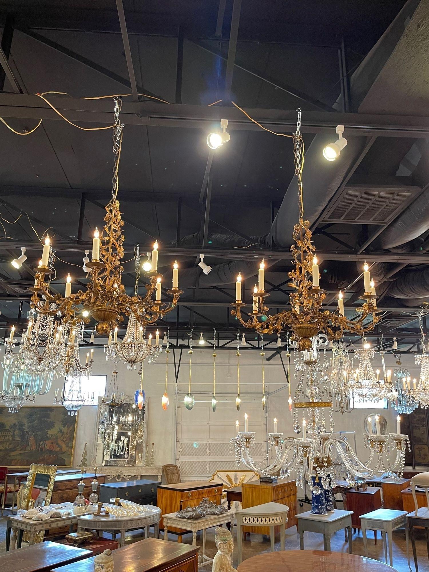 Exquisite 19th century Italian gilt tole floral chandeliers with 8 lights. These are very unique, covered in gold flowers and leaves. So pretty! Price listed is for 1.