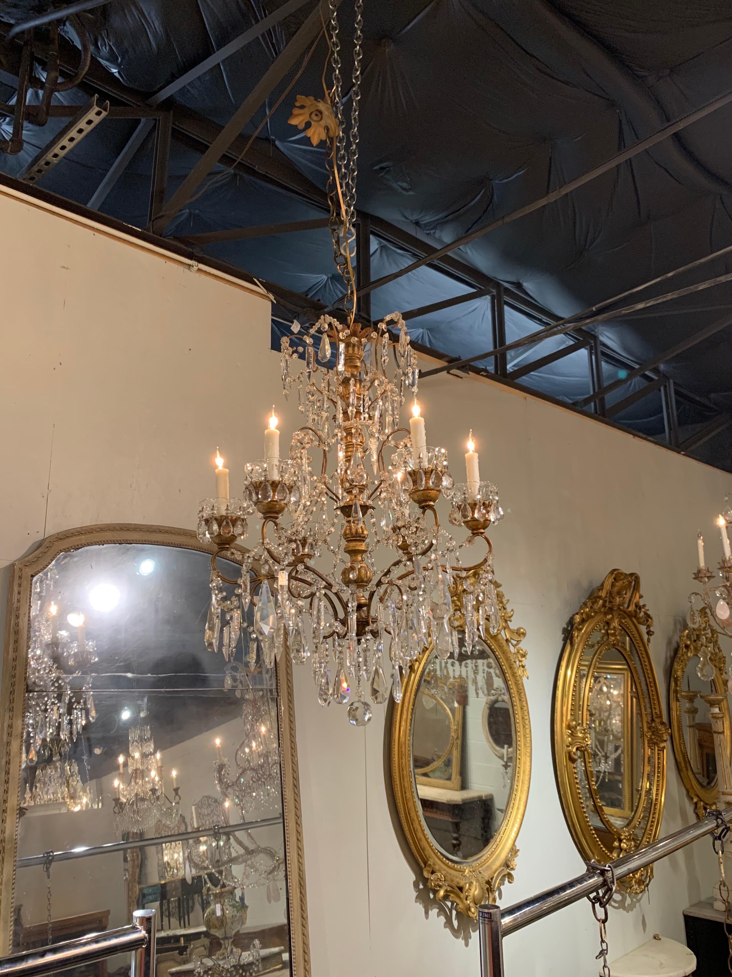 Very fine 19th century Italian giltwood and beaded chandelier with 6 lights. Beautiful giltwood base draped with a beautiful array of beads, crystals and prisms. So pretty!