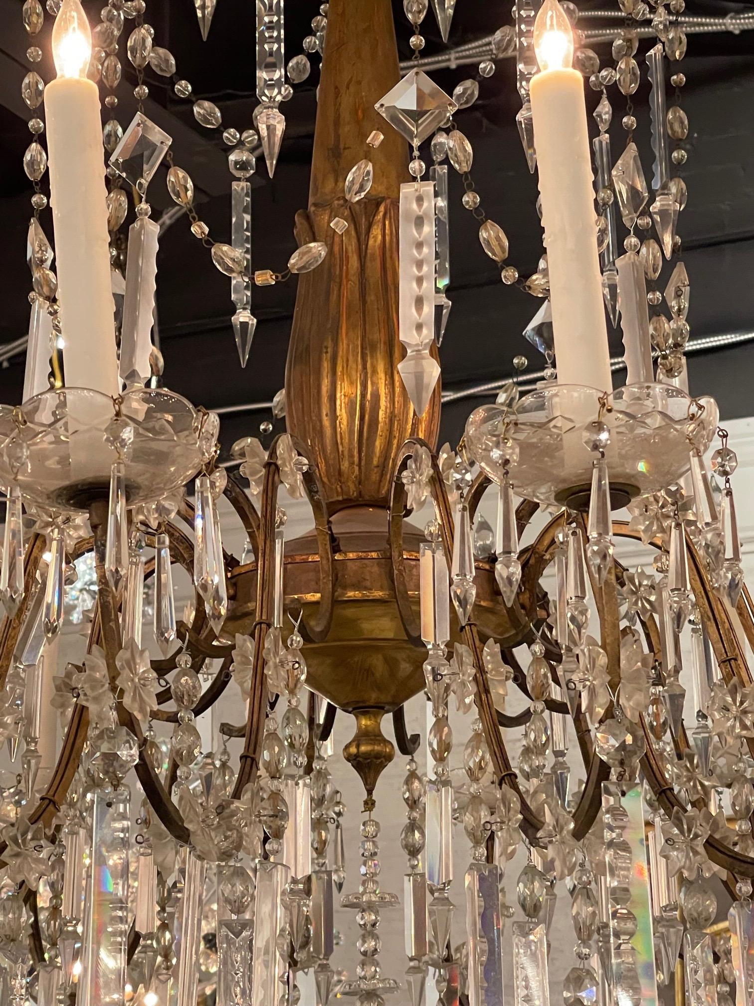 Carved 19th Century Italian Giltwood and Crystal 16 Light Chandelier For Sale