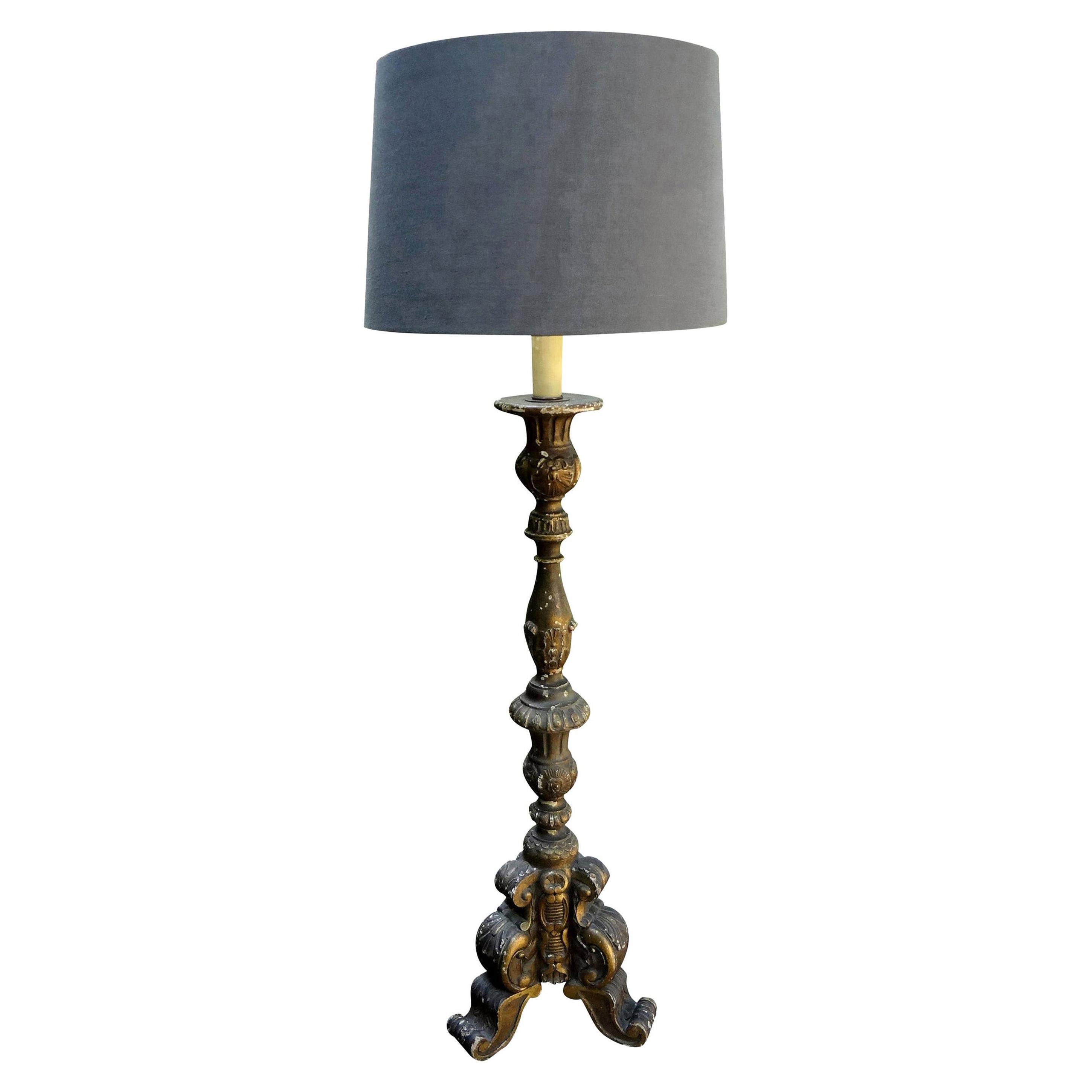 19th century Italian giltwood lamp.
Stunning tall 19th century Italian gilt wood candlestick or pricket that was converted into a table lamp. This gorgeous Italian giltwood lamp has been newly wired to U.S. specifications with a new socket and