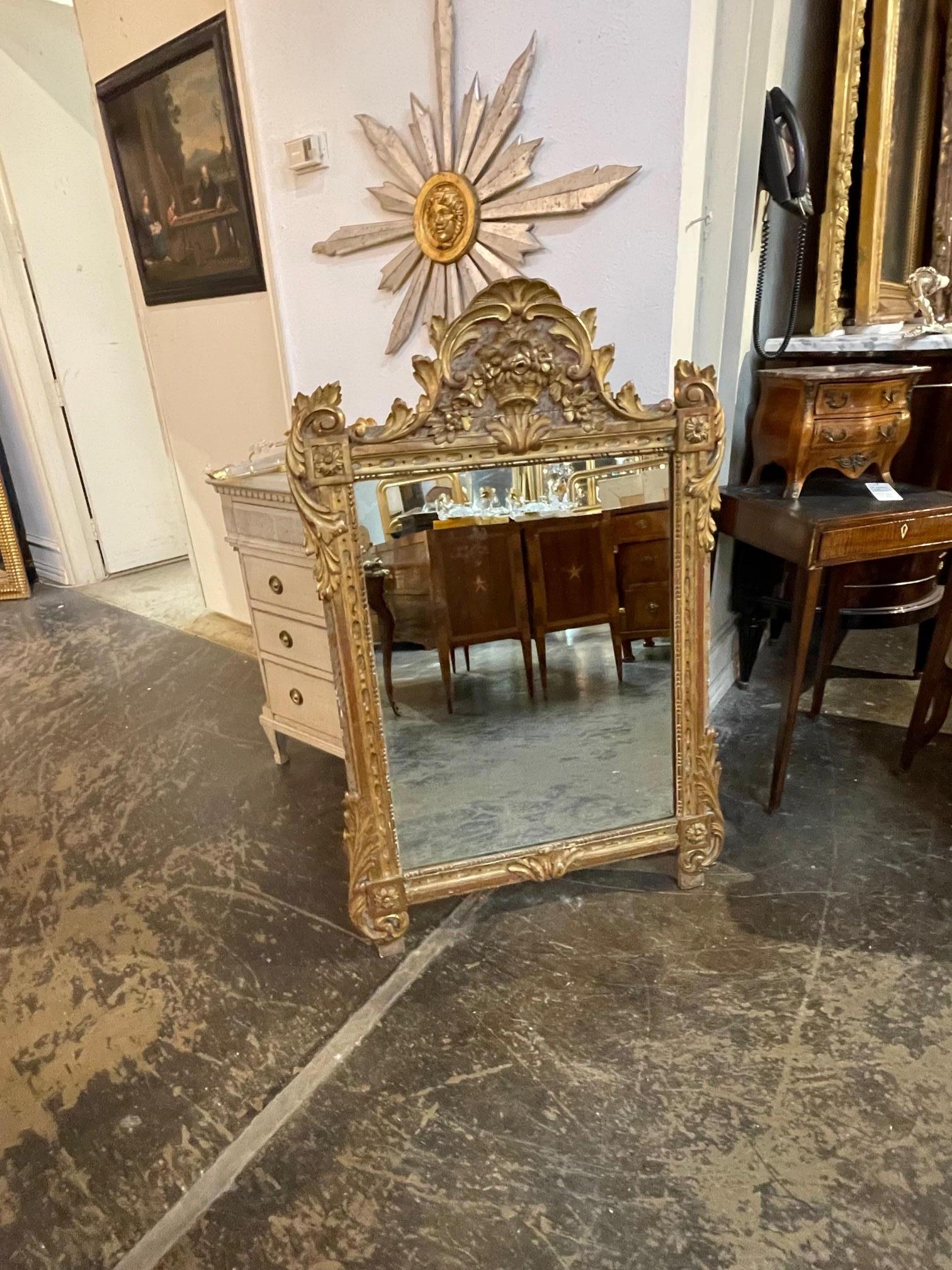 19th century Italian carved and giltwood mirror. Circa 1870. This is a fine quality nicely carved mirror. Sure to make a statement.