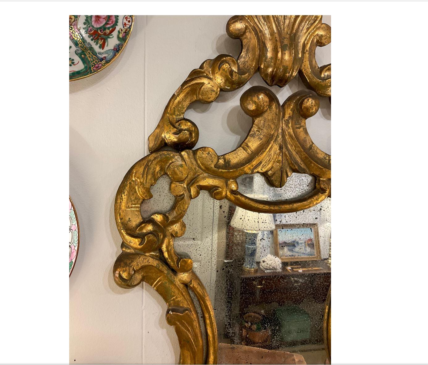 This 19th century Italian guilt mirror is so beautiful in person. The details of the mirror are perfect for any room that needs a little extra life.