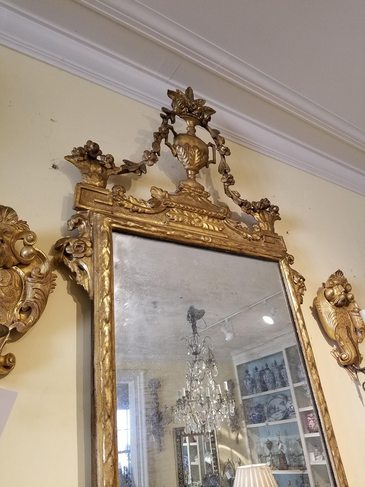 19th century Italian giltwood mirror, incredible carved urn with floral detail.
Beautiful