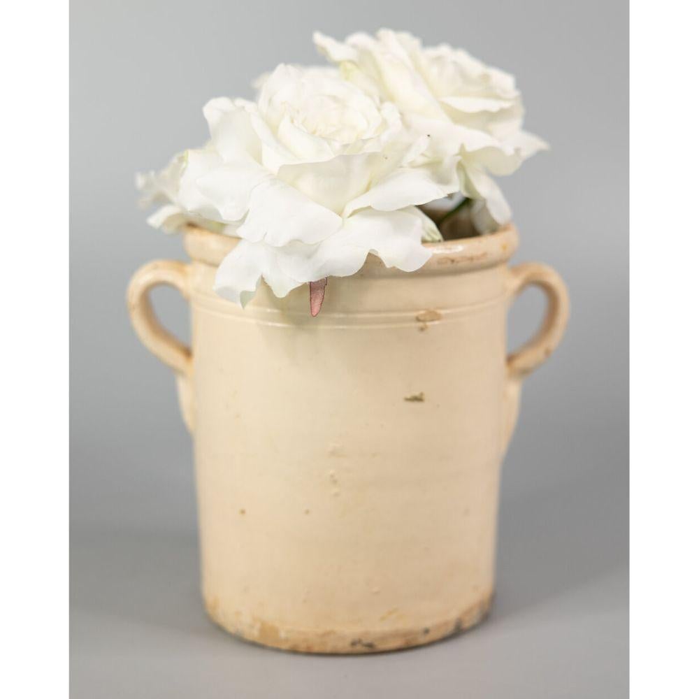 An authentic 19th-Century Italian confit pot or jar. This pot is full of character, hand crafted and painted with two charming handles, known as 'ears.' These jars were used for storing and preserving cooked meat. It would be beautiful with a