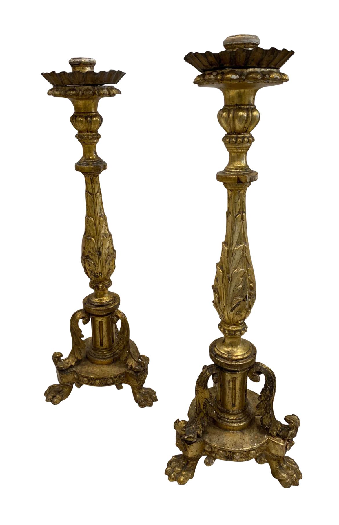 What a gorgeous pair of Italian gold gilt candlesticks with original bobeches! These are stunning and are such a unique shape that sit upon 3 lion paws on each candlestick. They can go traditional or also wabi sabi. Place alone on a console or on a
