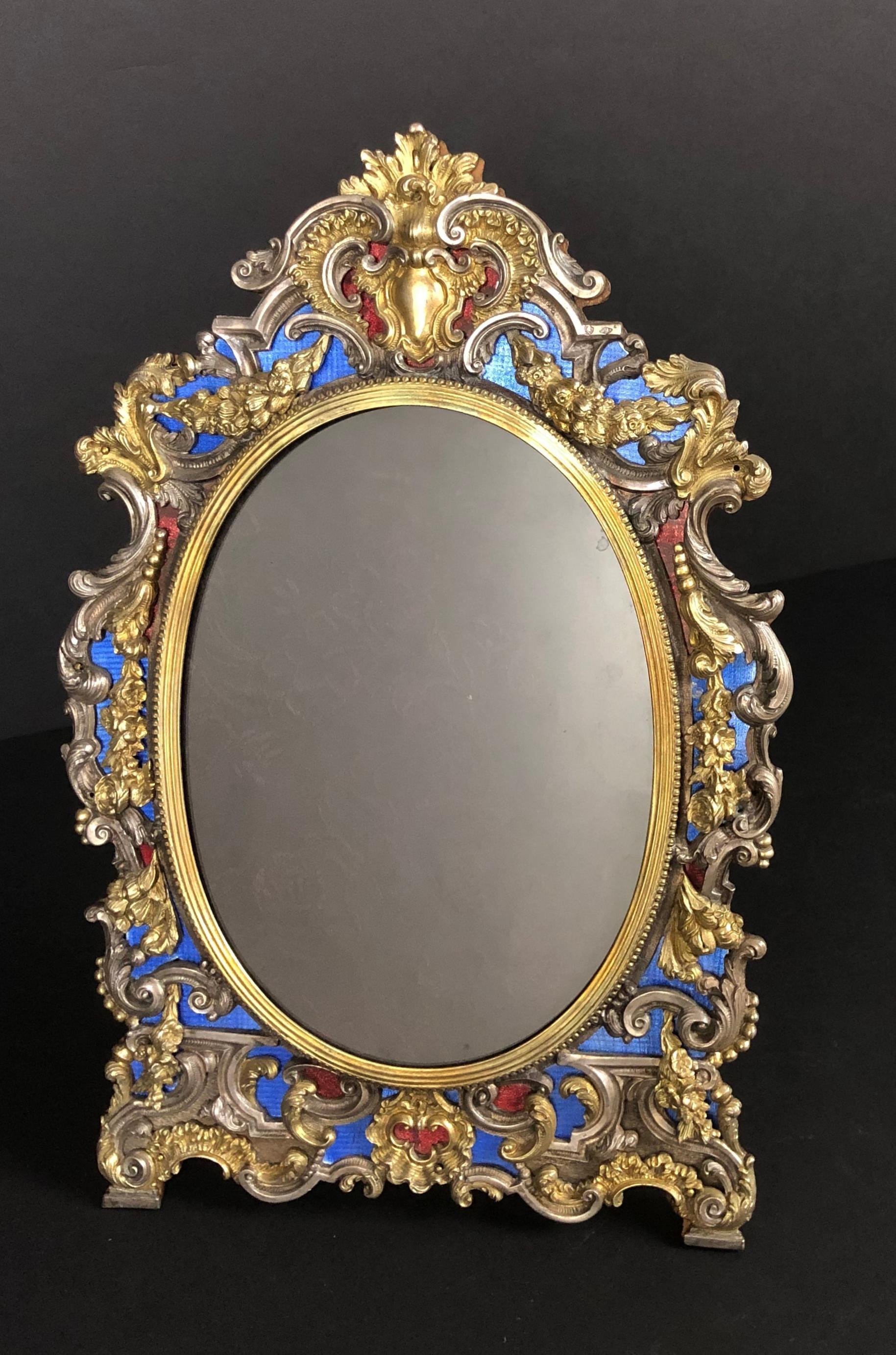Antique (gilt) vermeil over sterling silver ornate picture frame with red and blue vitreous enamel, Italy, circa 1890. Has hallmark on front. Oval frame is surrounded by beautiful scroll work and floral swag garlands.