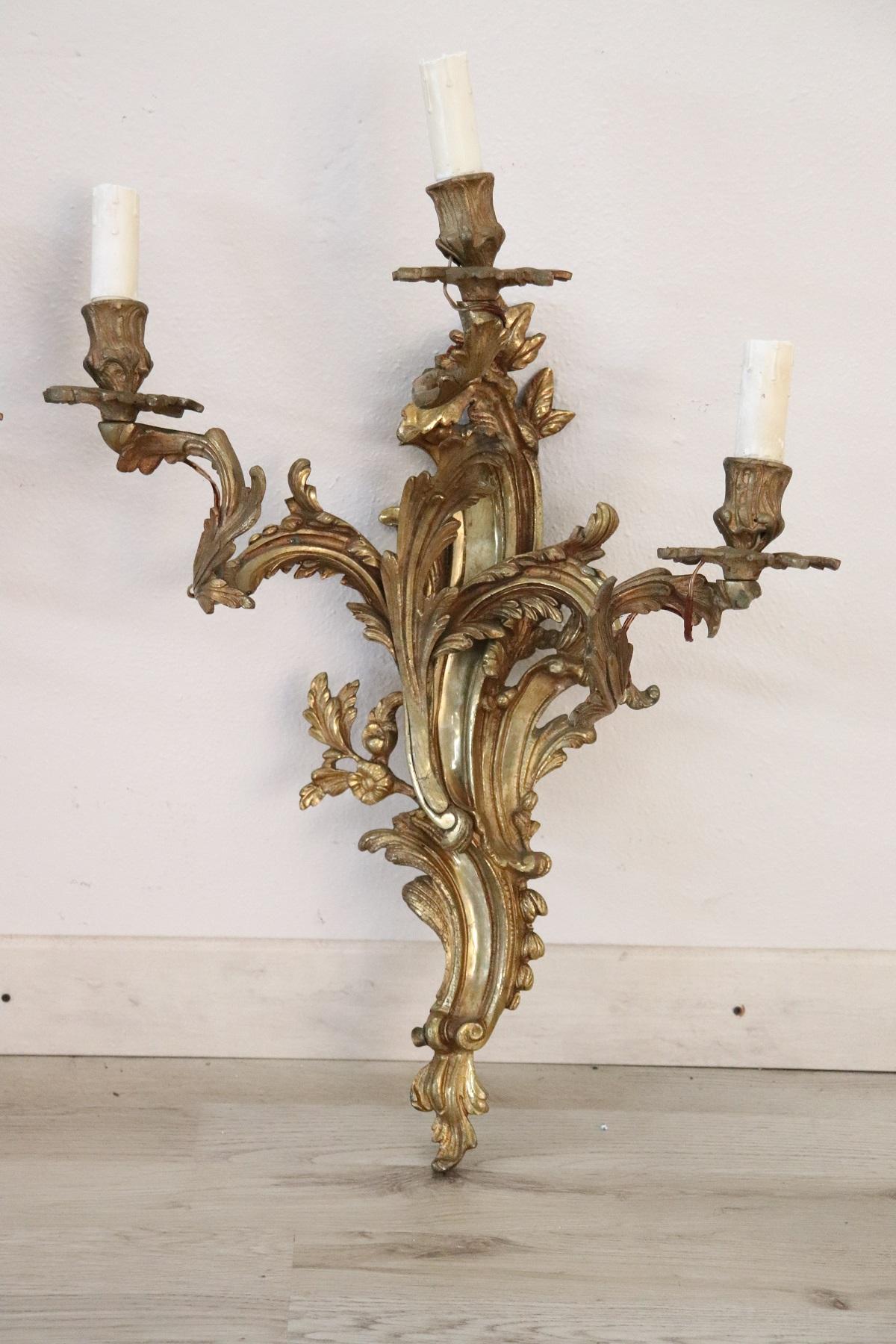 Beautiful and refined Italian circa 1890s pair of wall light or sconce three lights. Made of golden bronze. Art Nouveau decoration with leaves that rise up in volutes and support the lights. Very decorative and large perfect for your wall. Very