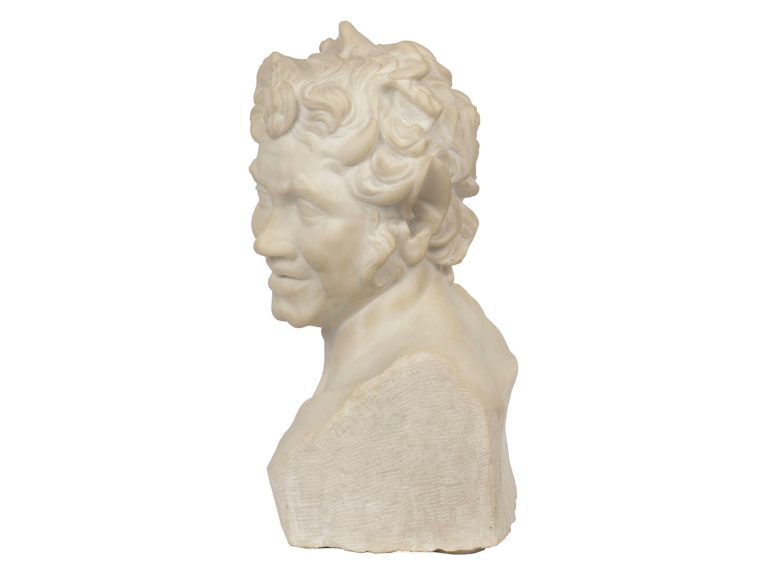 A whimsical and playful work from the mid to late 19th century, this fine marble bust depicts a jovial satyr as he looks off at some distant point. His eyes are bright and a smile tugs at his lips and cheeks. Beautifully conceived, the bust has a