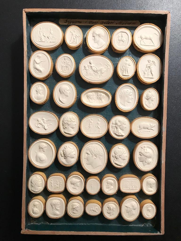 An all original boxed set of Grand Tour Italian plaster intaglios in almost pristine condition. Often these sets are broken up and framed for resale, it is rare to find them in their original condition. These are very fine examples of the craft,