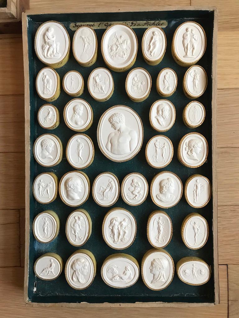 An all original boxed set of 4 trays of Grand Tour Italian plaster intaglios by Luigi Pichler. Pichler was born in Rome in 1773 to the most important family of gem carvers working in Rome in the 18th century. The Vatican and other museums own