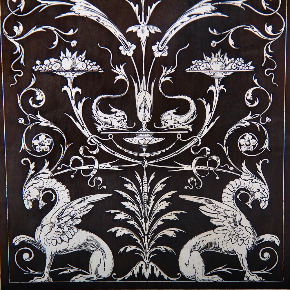 A 19th century Italian Renaissance-style single door cabinet in ebony, profusely inlaid with flowers, swags, leaves, griffons etc. of bone, the inlaid motifs further detailed with fine engraving.
The single inlaid door is flanked by pilasters, each
