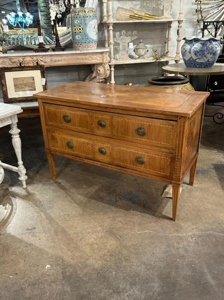 Handsome late 18th century Italian Neo-classical inlaid commode. Featuring a very fine wood finish and a lovely inlaid pattern. A classic beauty!