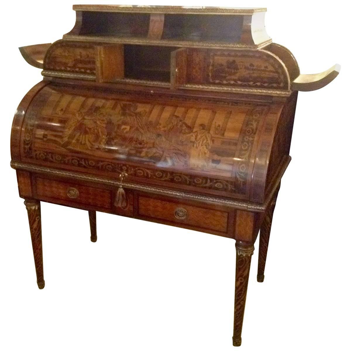 This antique secretary desk was handcrafted from precious mahogany in a neoclassical style in Italy during the early 20th century. Its beautifully glossy hardwood body is elaborately inlaid with a variety of other woods, including ebony, that create