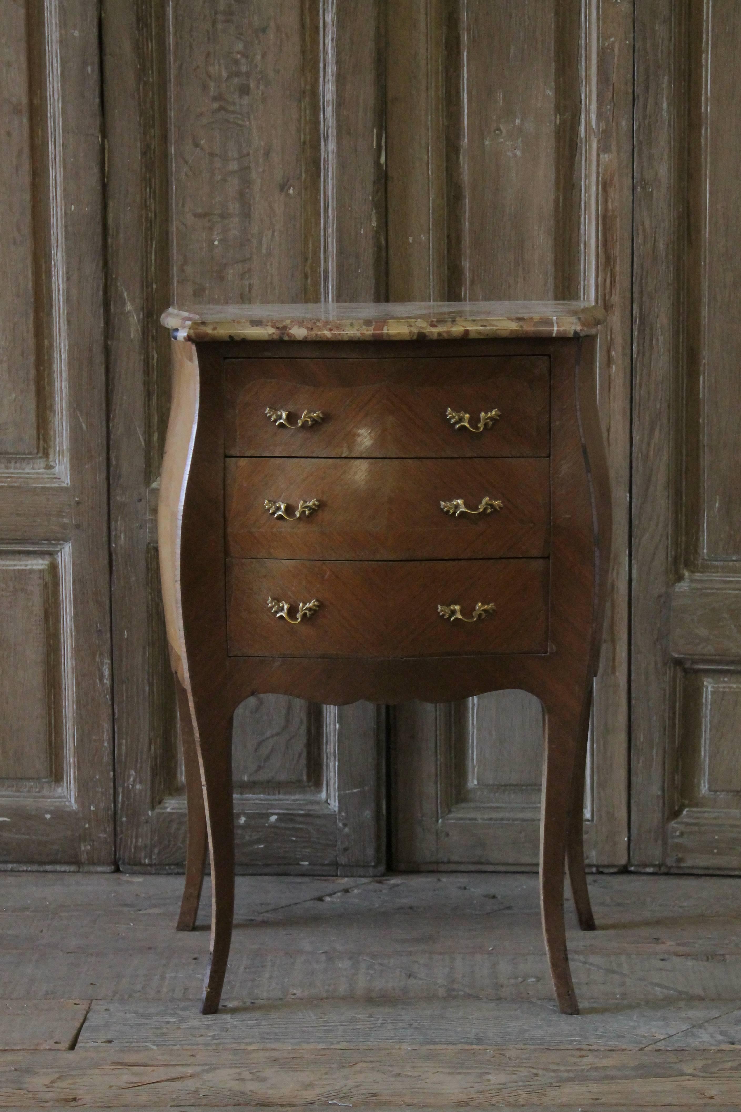 19th century Italian inlay commode side table with three drawers and marble top.
Drawers open and close with ease, made with a dovetail construction. Original gilt bronze French style pulls.
Original marble-top, in tan creams, brown and rust