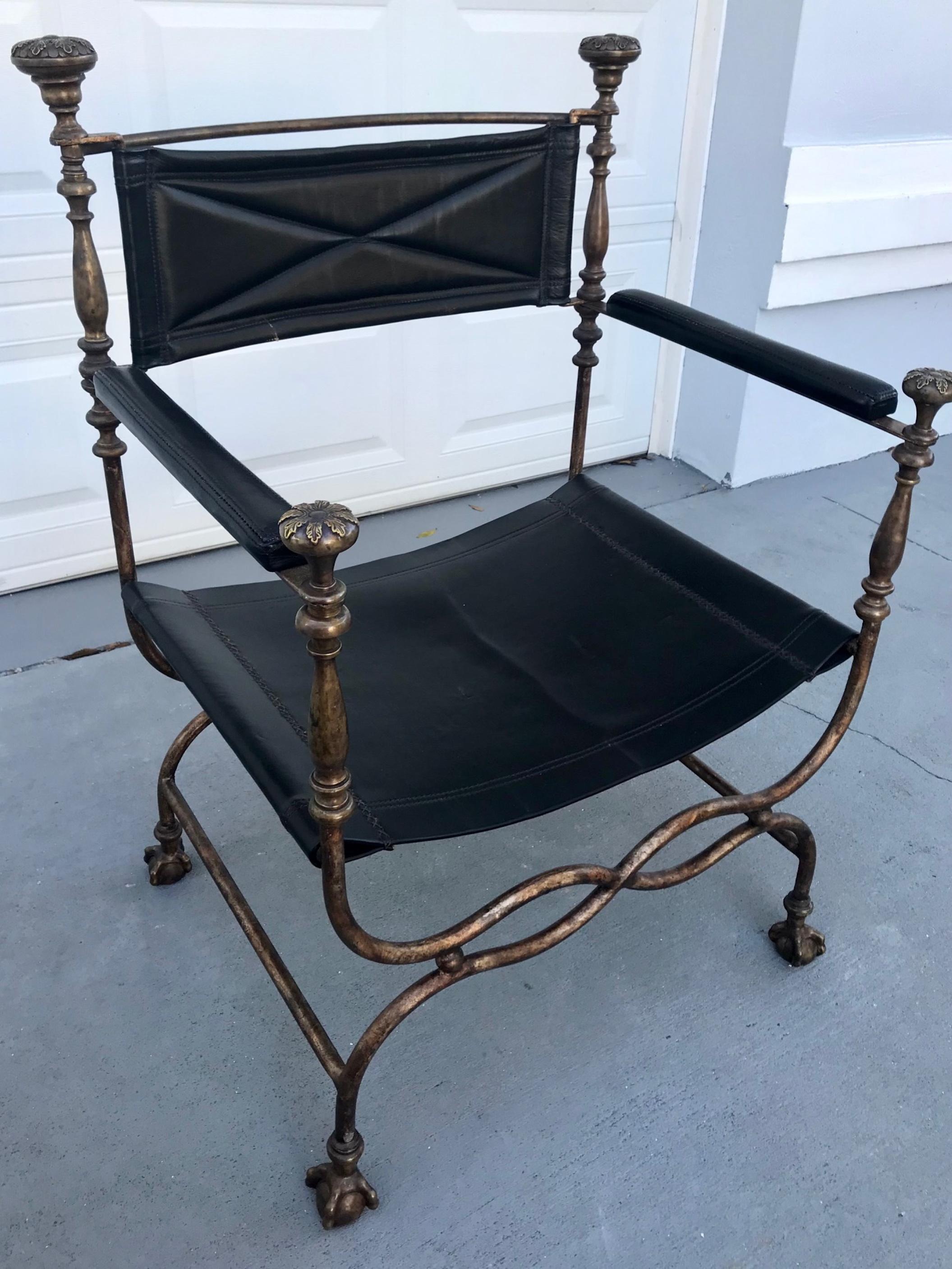 19th century Italian iron/bronze Savonarola Dante chair.

Stunning Italian, iron and bronze Savonarola Dante chair. The curving wrought iron X-frame is topped with ornate bronze finials flanking the backrest and the front on each arm. This