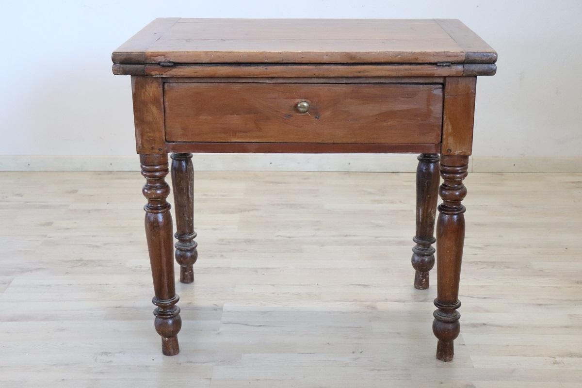 Beautiful very nice Italian solid poplar wood kitchen table, 1850s. The table is very simple and linear, characterized by solid turned legs. Equipped with a large drawer internally divided because it was used to contain cutlery separately. The top
