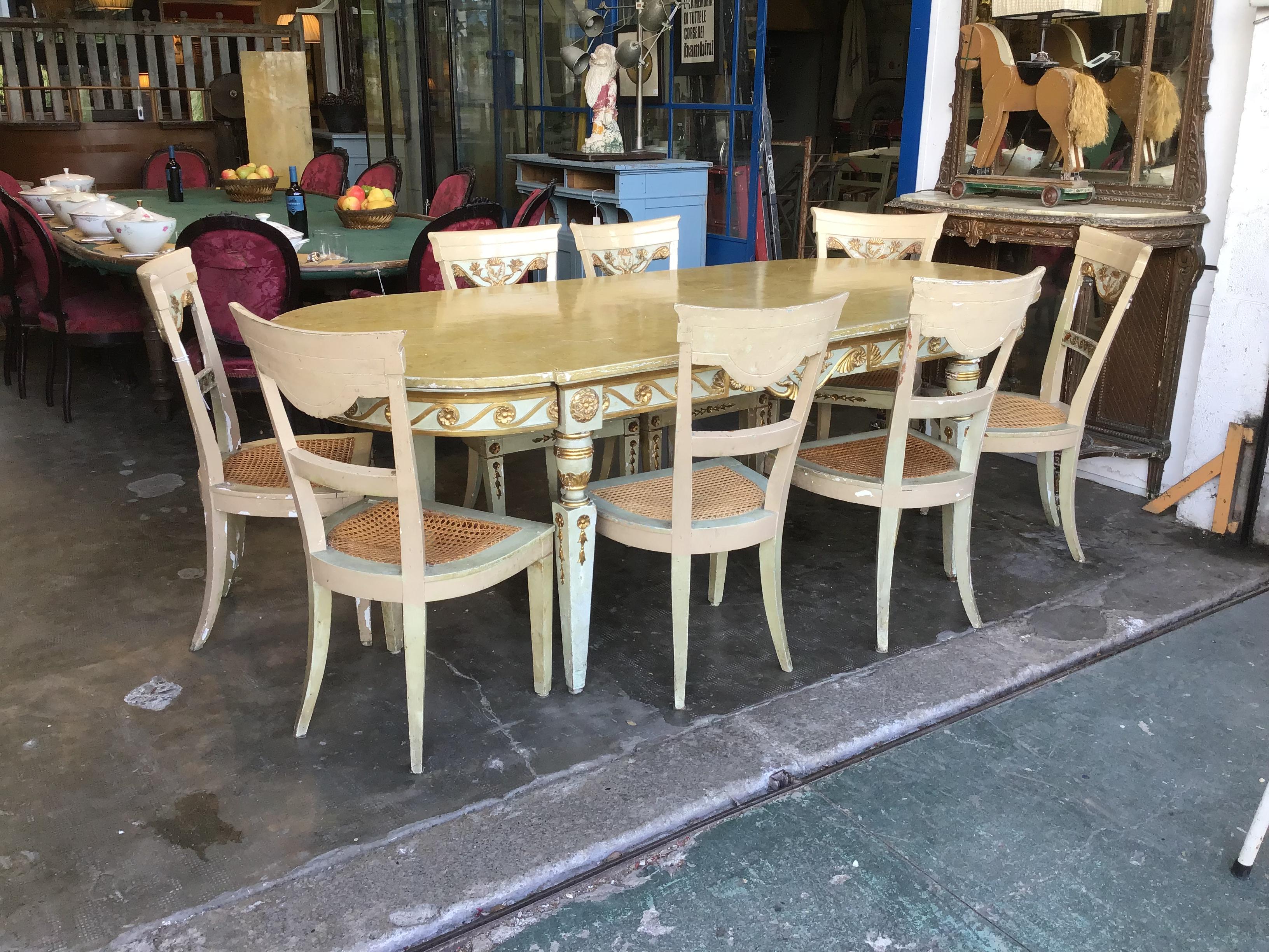 19th century Italian lacquered wood dining room set composed by one table with drawers and eight chairs with Vienna Straw.
The whole set is in very good vintage condition except one of the chairs that has some damages on the Vienna straw. It is