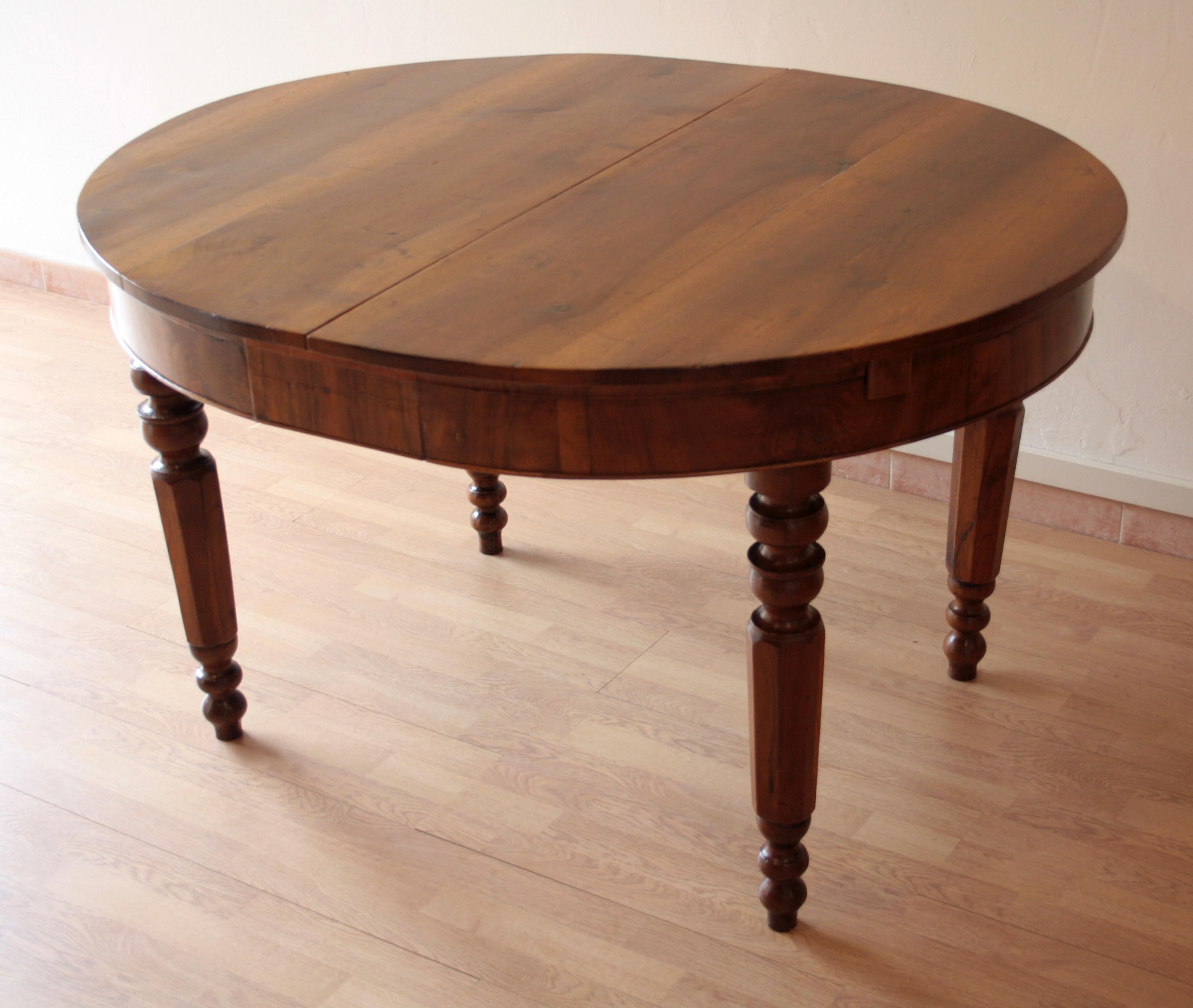 Beautiful original solid walnut table from the late 19th century. Built in southern Italy. Walnut legs turned. Extendable with original walnut extensions. Dimensions, when opened with extensions, the table top becomes 170 cm long x 110 cm wide.