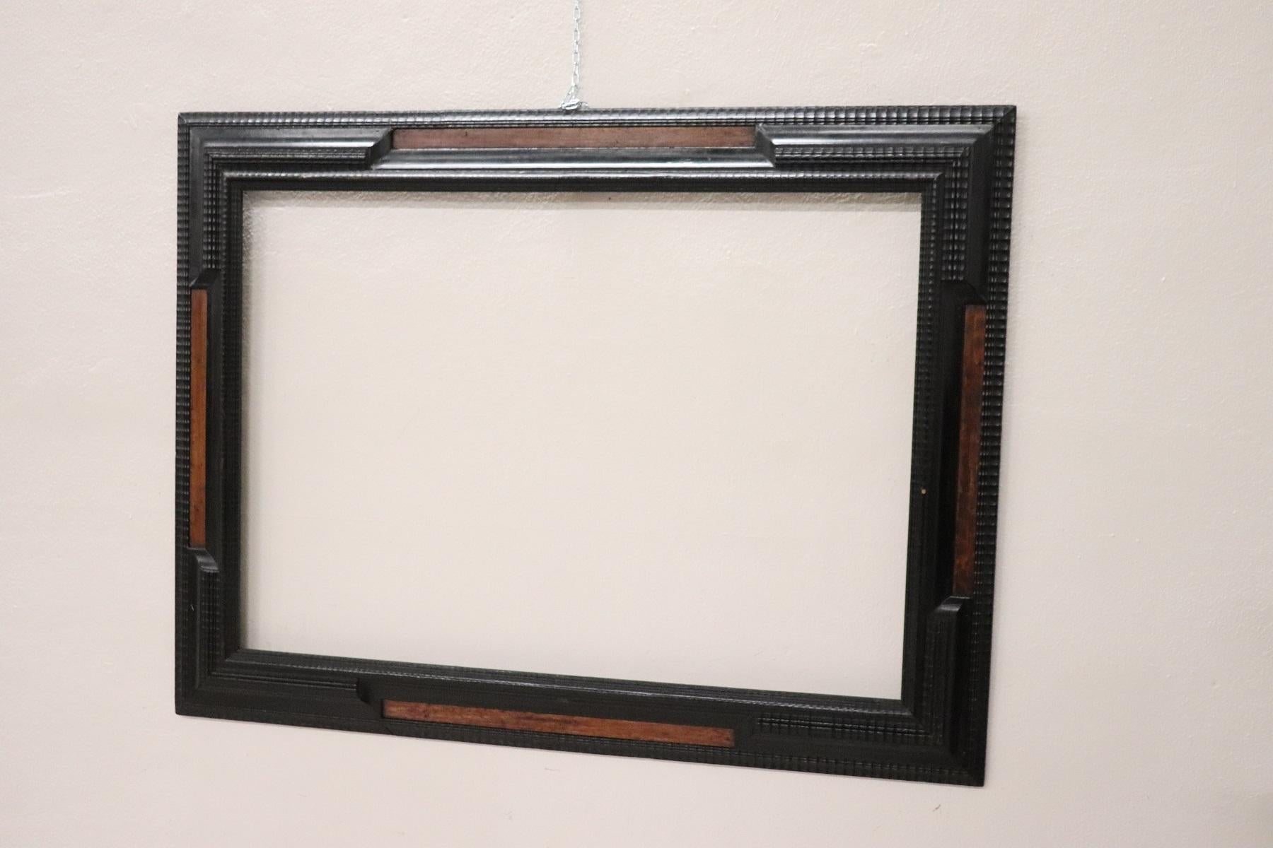 Refined frame from the end of the 19th century, a typical decoration called guilloché made of wood and ebonized in black tint as the taste of the period required.