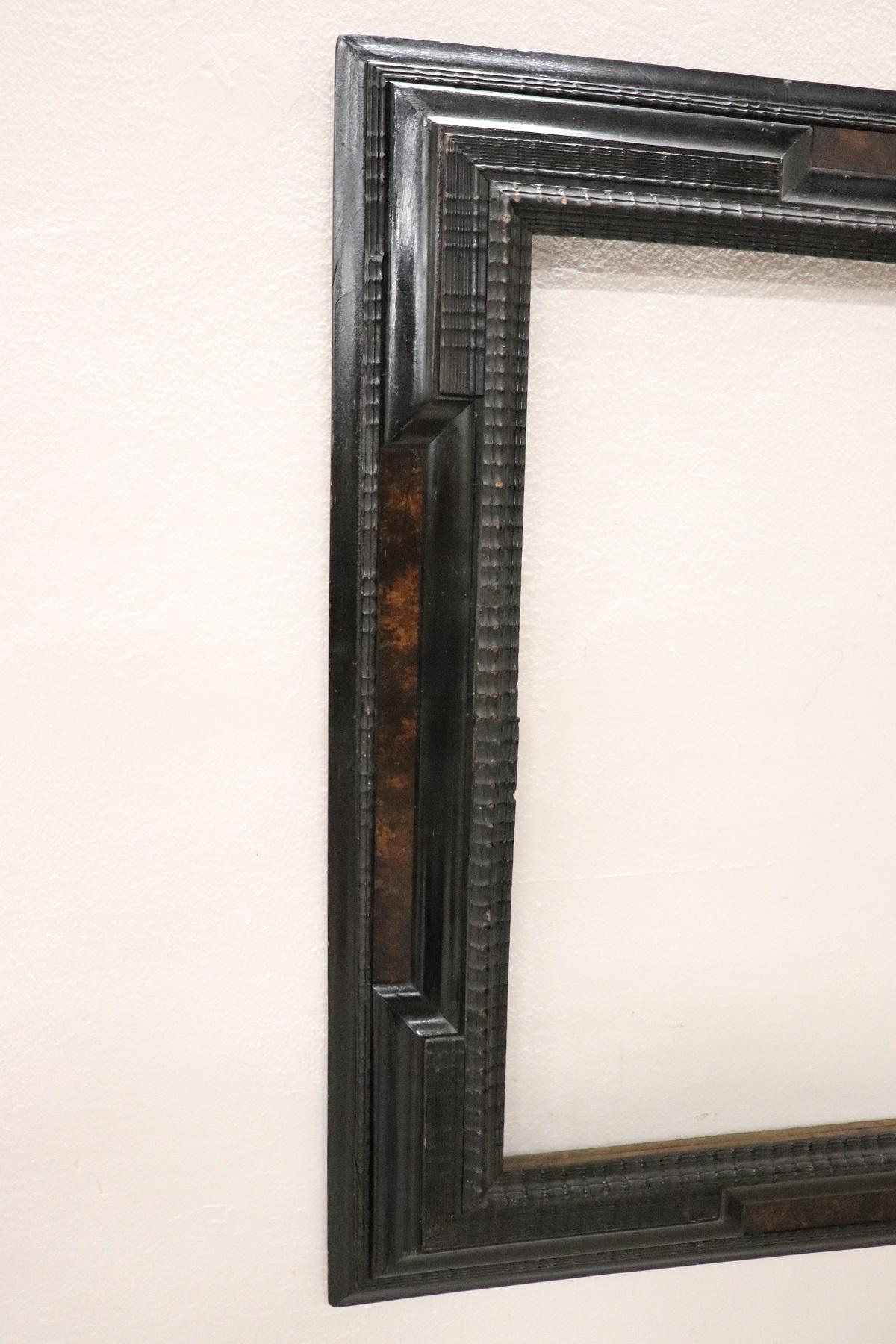 Refined frame from the end of the 19th century, a typical decoration called guilloché made of wood and ebonized in black tint as the taste of the period required.