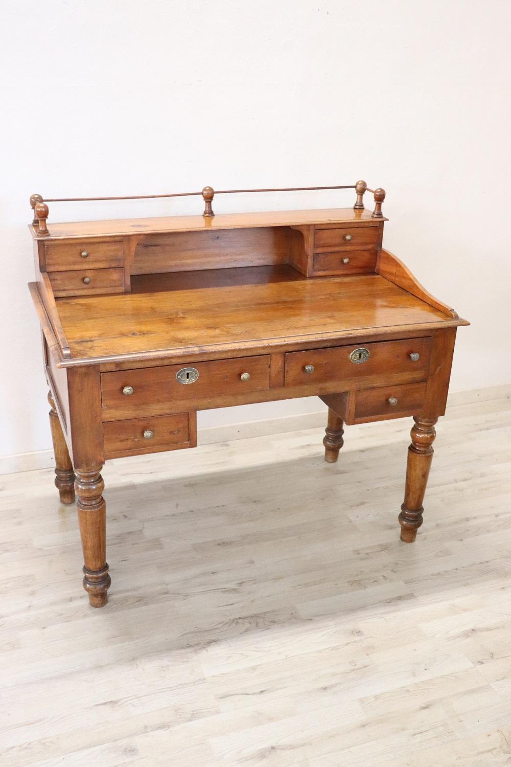 Elegant antique Italian writing desk. Rare and precious solid walnut wood. Comfortable size for a practical use. The desk has elegant turned legs. In the lower part four drawers and in the upper part four smaller drawers. Excellent condition ready