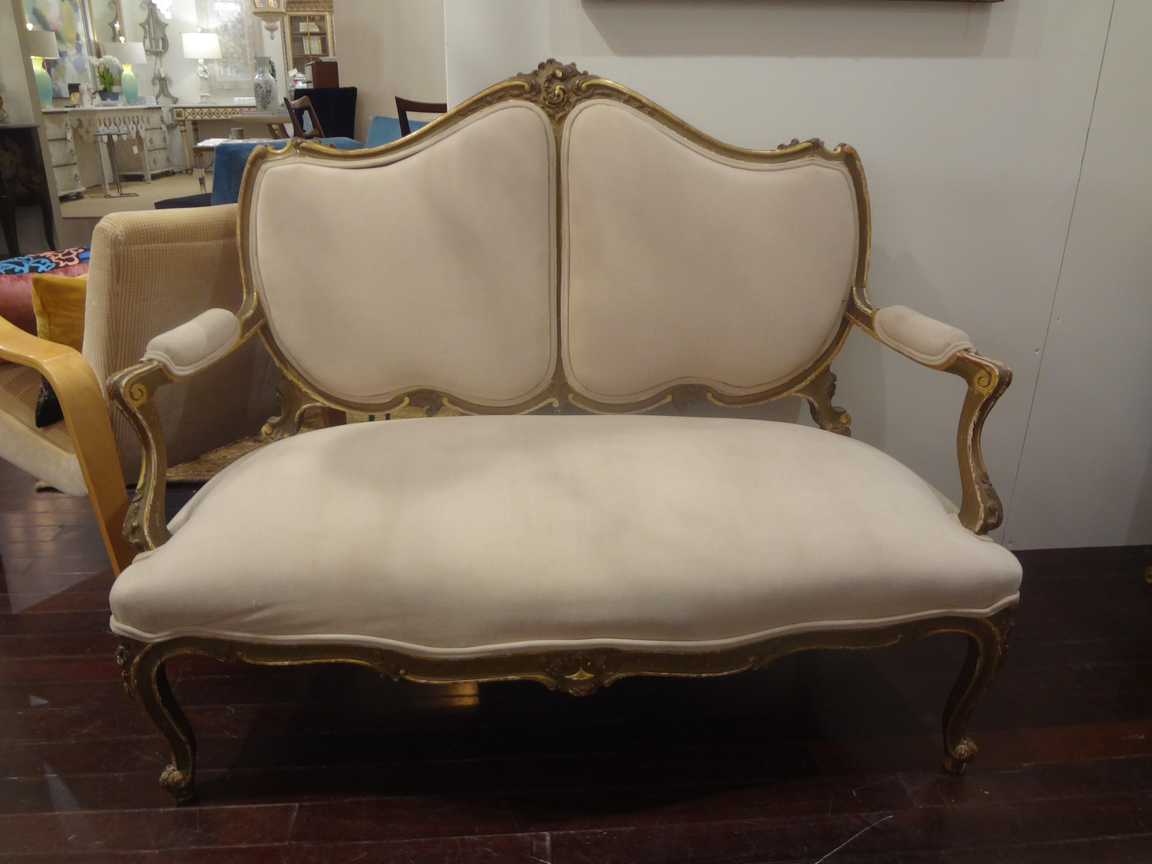 19th century Italian Louis XV style giltwood loveseat.
Lovely 19th century Italian Louis XV style giltwood loveseat, sofa, canapé or settee. This antique sofa would work well in an entrance hall, living area, dressing room or bedroom. This stylish