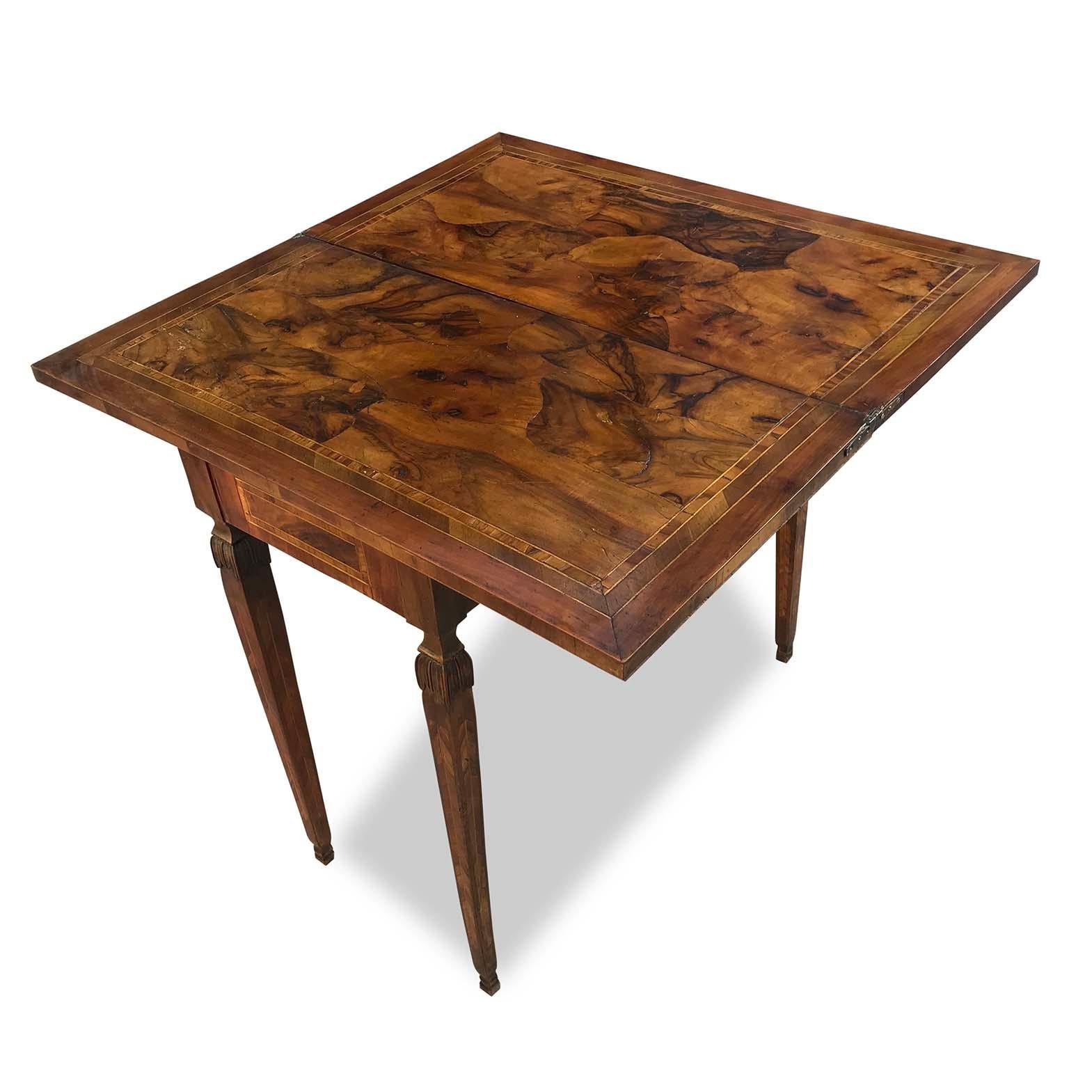 Very elegant extendable, one leaf, tea table, a fold over extremely versatile table, can be used as game or console table, dating back to early 19th century. 
The table is burl veneered, a very good quality piece of furniture at the time. The top