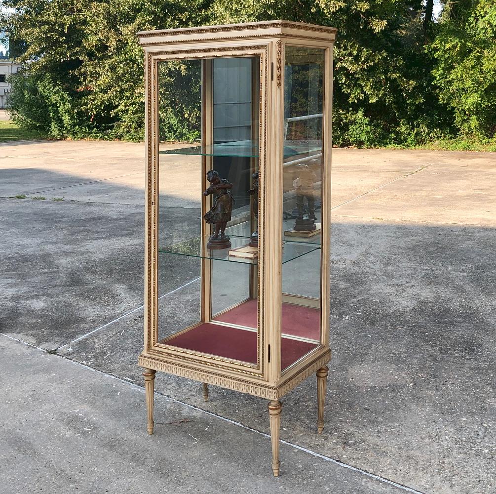 19th century Italian Louis XVI painted vitrine was designed to showcase a family's cherished family heirlooms or a collector's prized pieces! Crafted in the classical style inspired by the architecture of ancient Greece and Rome, this example