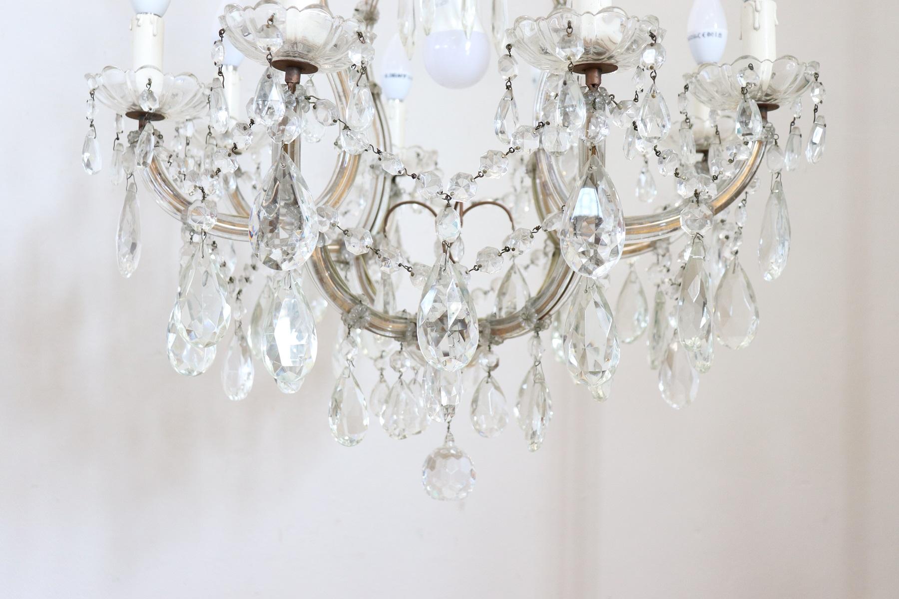 Beautiful and refined Italian Louis XVI style, circa 1880s chandelier nine lights. In bronze and completely covered drops of crystal. The crystal exudes the typical brightness; the drops are finely worked giving an elegant light. Chandelier of