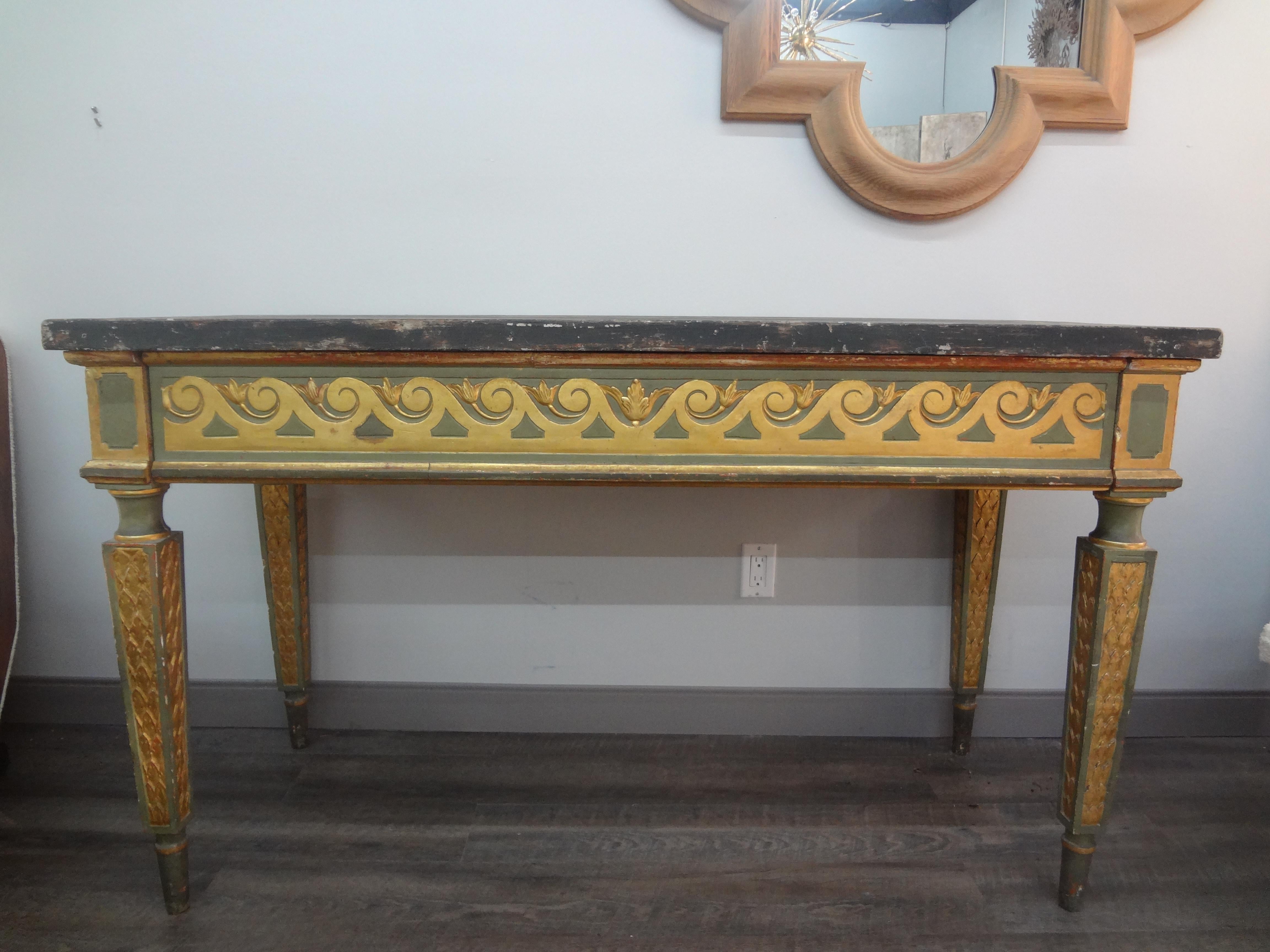 19th Century Italian Louis XVI Style Painted And Parcel Gilt Console Table.
Our large antique Italian Neoclassical style painted and giltwood console table has a painted finish with a lovely wave design in gilt on three sides with a single drawer