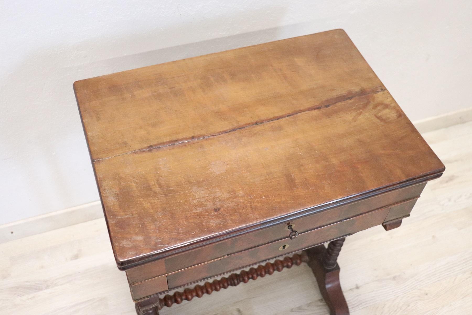 Beautiful side table, 1880s in mahogany. Table with elegant turned legs. Two comfortable drawers on the front. Internal compartments for your jewelry. A convenient internal mirror to use for make-up. The table will be delivered to you in perfect