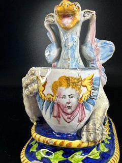 19th Century, Italian Majolica Dragon Stand – Polychrome Glaze, Putto Portrait