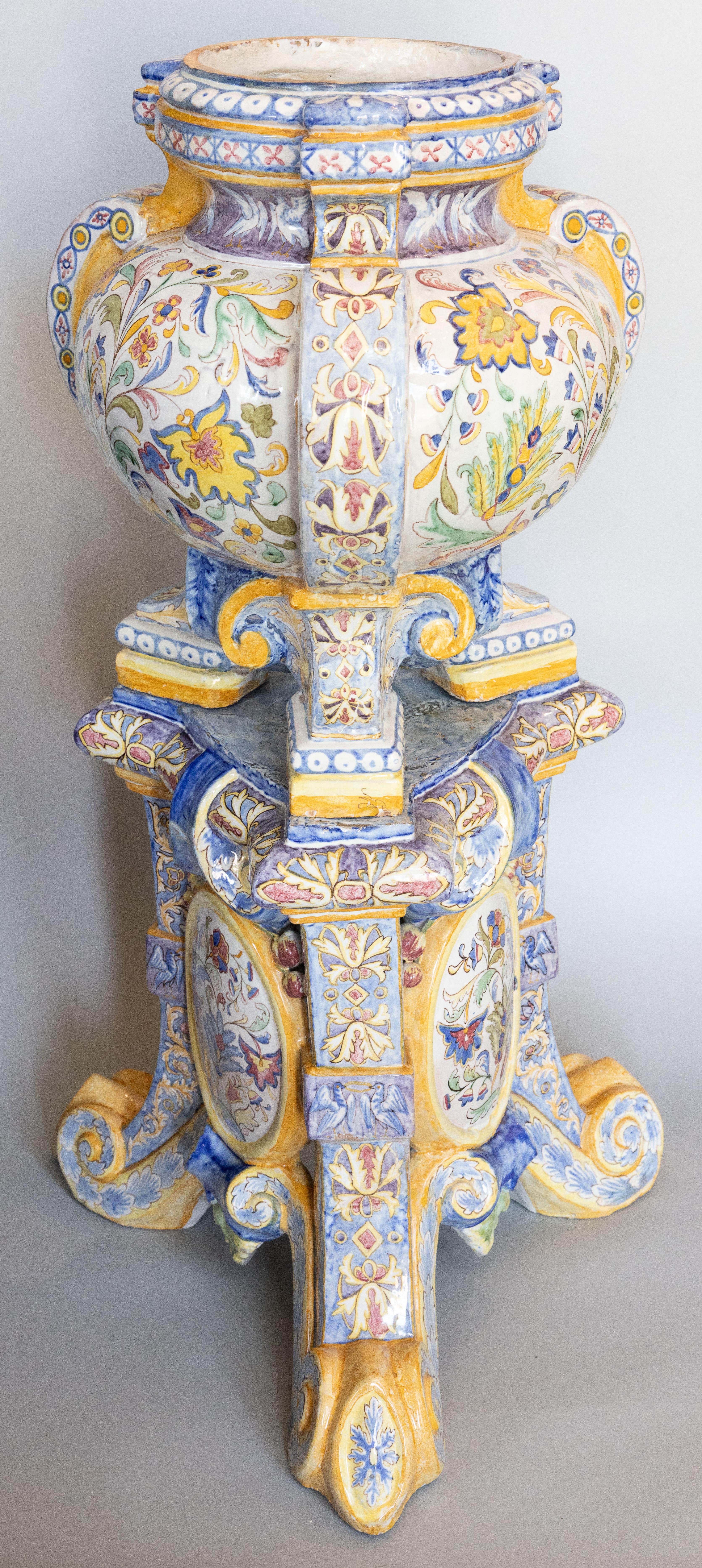 Italian Majolica jardiniere and accompanying stand in the style of Giorgio Andreoli (1470-1555). Decorated in the Renaissance style with arabesques, graffito, and floras in various polychrome colors on a white ground. The shaped jardiniere rests on