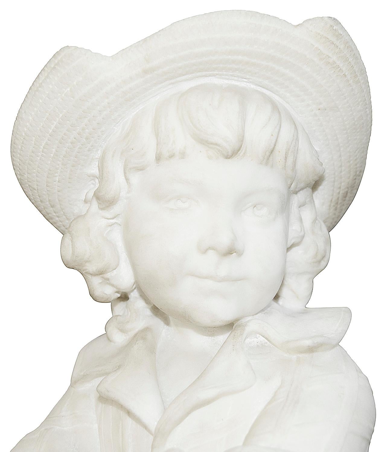 A very good quality 19th century Italian Carrara marble statue of an enchanting young boy sitting on a wooden fence. Mounted on a 19th century green marble pedestal.
In the manner of Pietro Barzanti
Statue measures: 77cm (30
