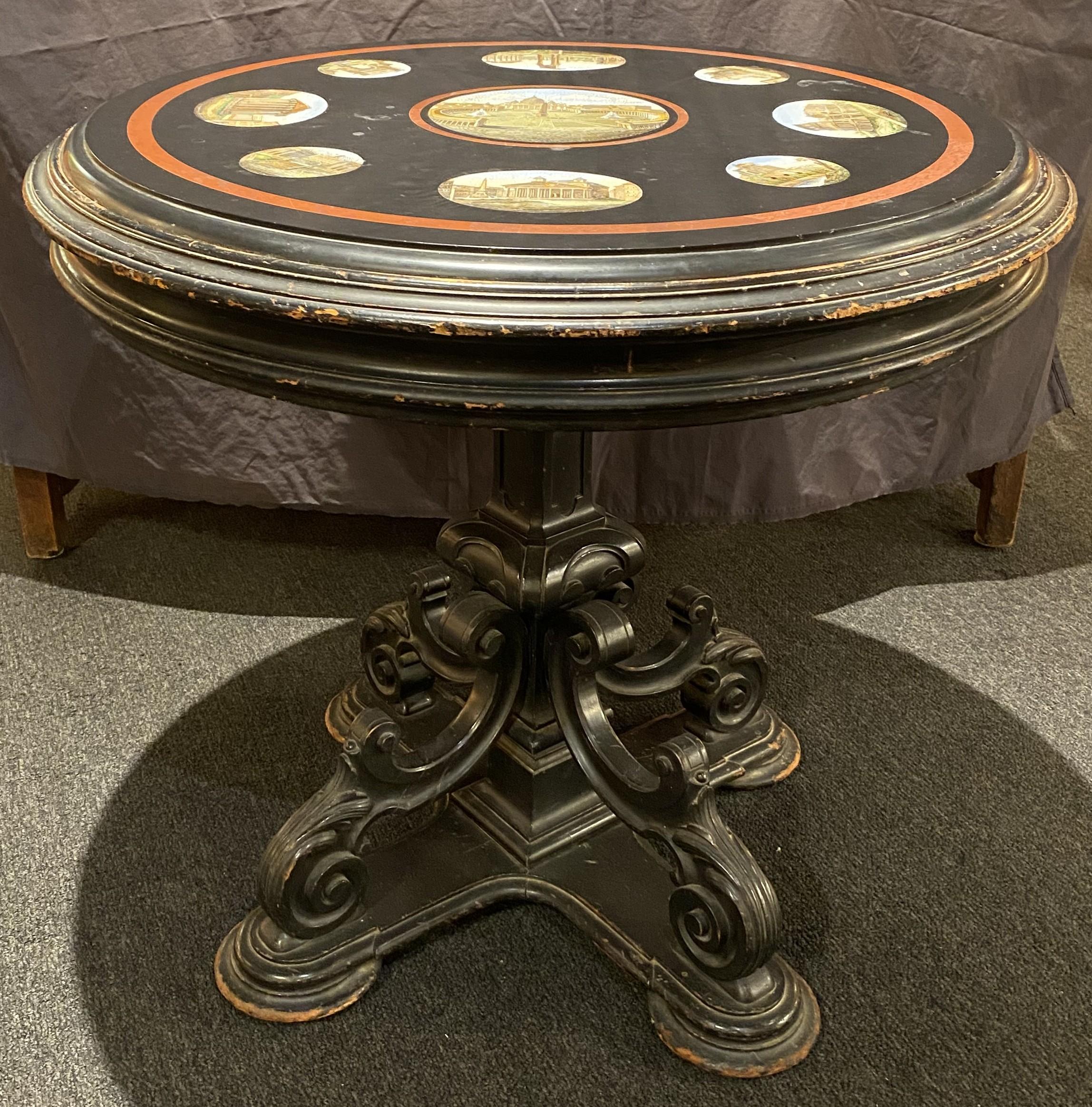 An exceptional 19th century Italian micro mosaic round center table featuring architectural scenes from Rome including a central scene of Saint Peter’s Basilica with a brick red marble band, surrounded by smaller oval scenes of the Colosseum, The