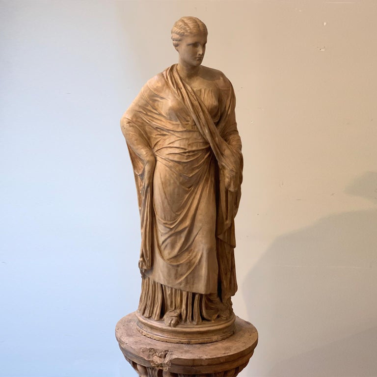 Elegant sculpture in terracotta from Signa, a manufacture existing in the 19th century near Florence.
The sculpture represents a Vanere dressed in a Roman Toga, a Classic Renaissance style reminiscent of the Classical Roman era. The female figure
