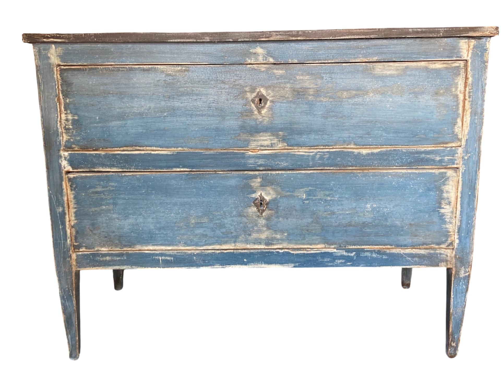 Neoclassical commode hand-made in Italy in the mid to late 1700s using walnut. The commode shows very simple lines, as typical of the style, which give it a very modern look. The blue color (which is not original) but has fantastic patina. The chest