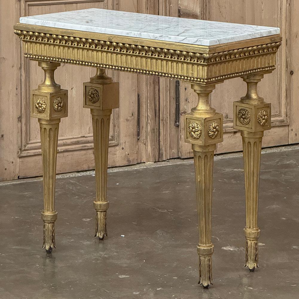 19th Century Italian Neoclassical Giltwood Console with Carrara Marble is an amazing example of fine craftsmanship and timeless style, rendered by the master artisans of Milano!  The top was quarried from the storied Carrara region where masons and