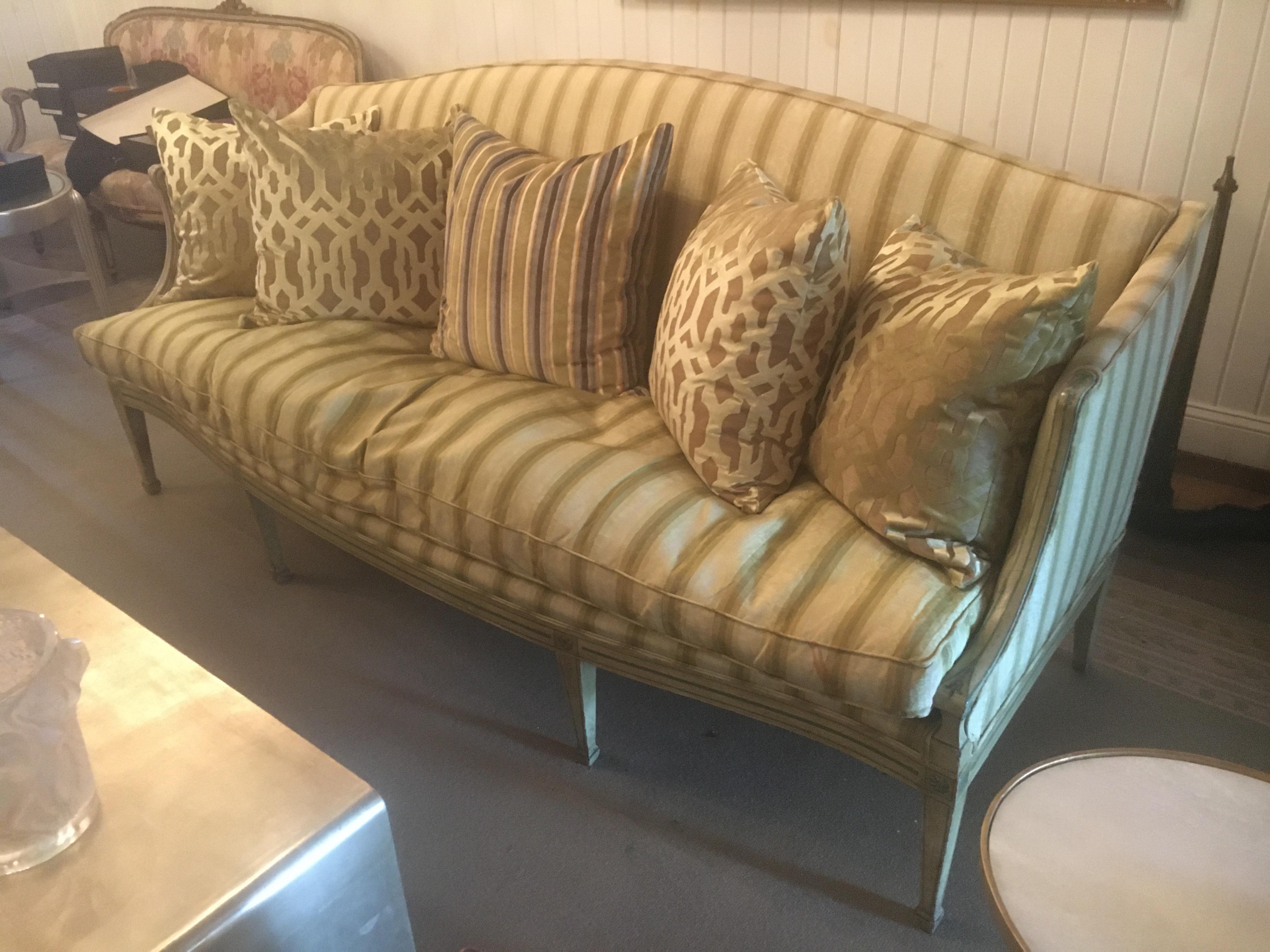 Handsome 19th century Italian neoclassical sofa with painted decoration. Celadon stripped silk upholstery.