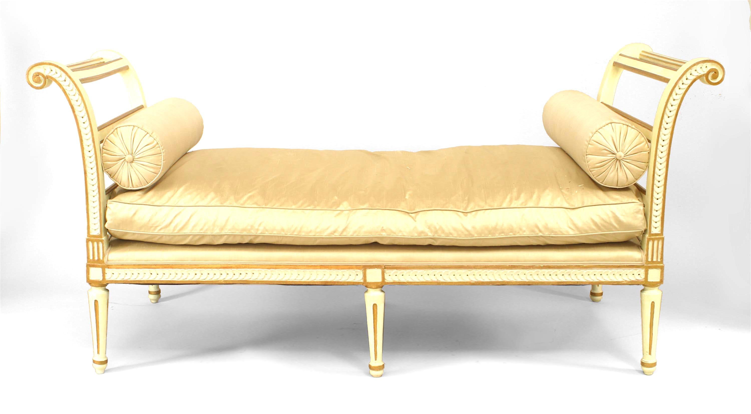Italian Neo-classic-style (19th Century) white painted daybed / bench with gilt trim and scroll design side arms and upholstered seat cushion.
