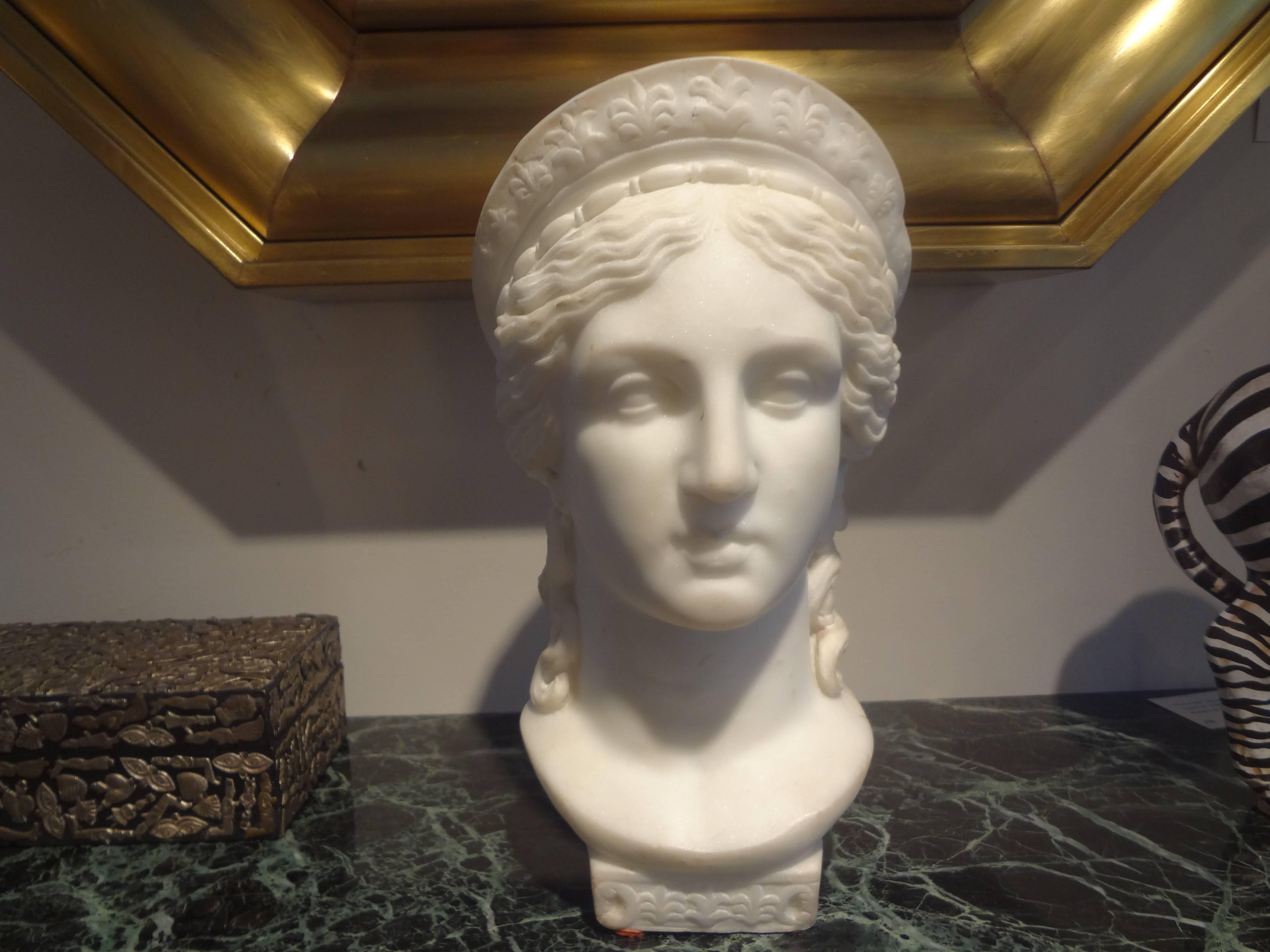 Finely carved 19th century Italian classical marble bust. This sculpture adds a touch of neoclassicism to a variety of interior styles. This bust was possibly a Grand Tour item.