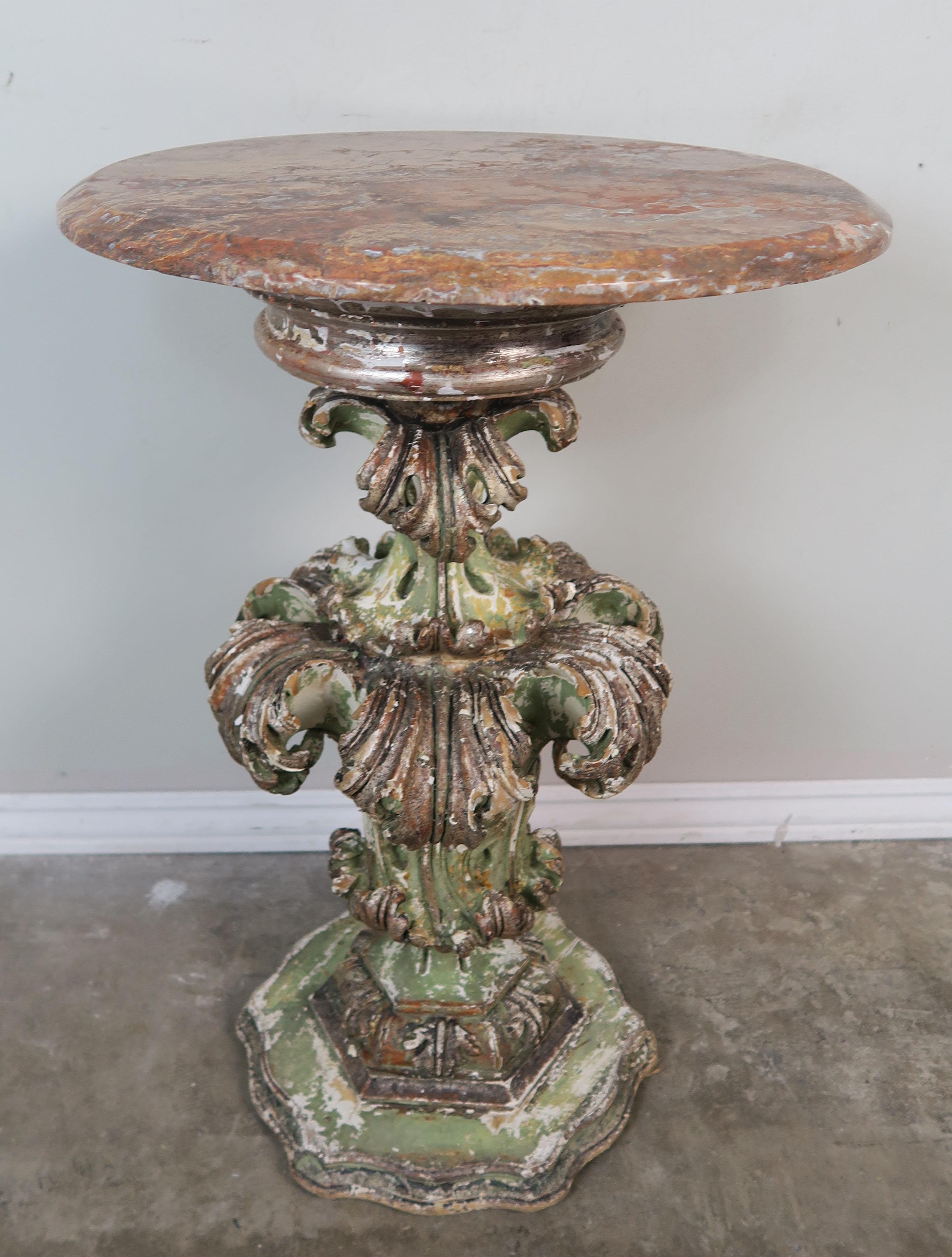 19th century Italian hand-carved acanthus leaf painted side table in shades of green and gold. The table has a round marble top. Beautiful worn painted finish throughout.