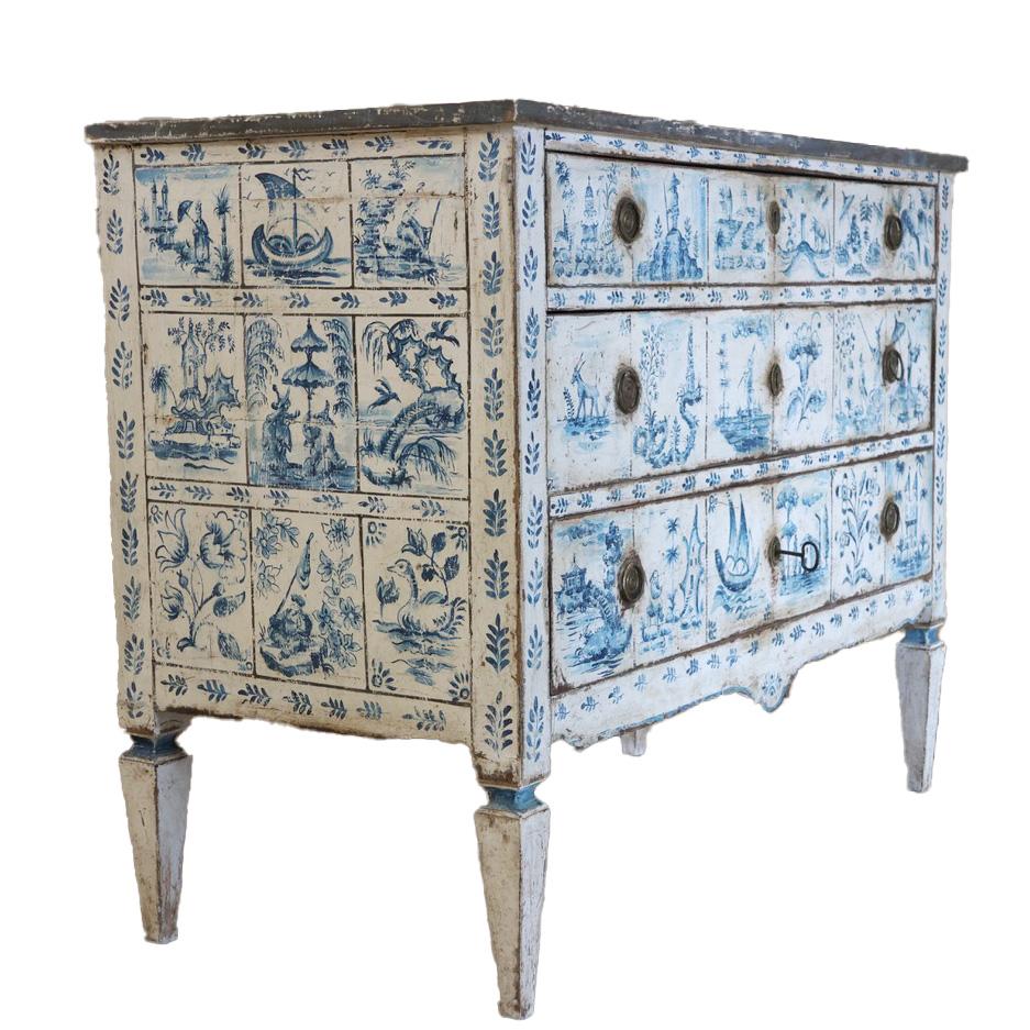Early 19th century painted commode , with later hand painted decoration in the Delft manner, with chinoiserie details. This elegant blue and white painted chest of drawers, will make a statement in most settings.
