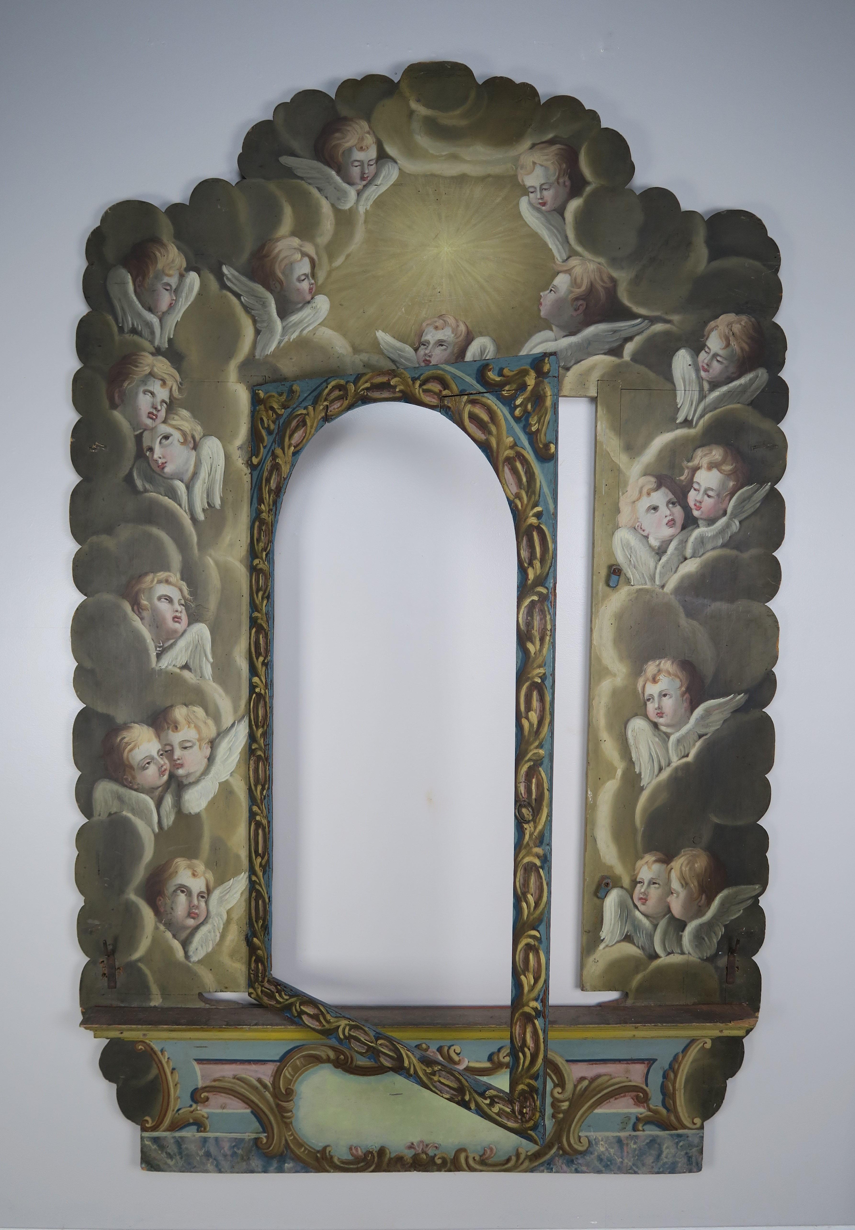 Incredible hand painted frame with cherub faces intricately painted throughout floating throughout clouds as though they are ascending towards heaven.