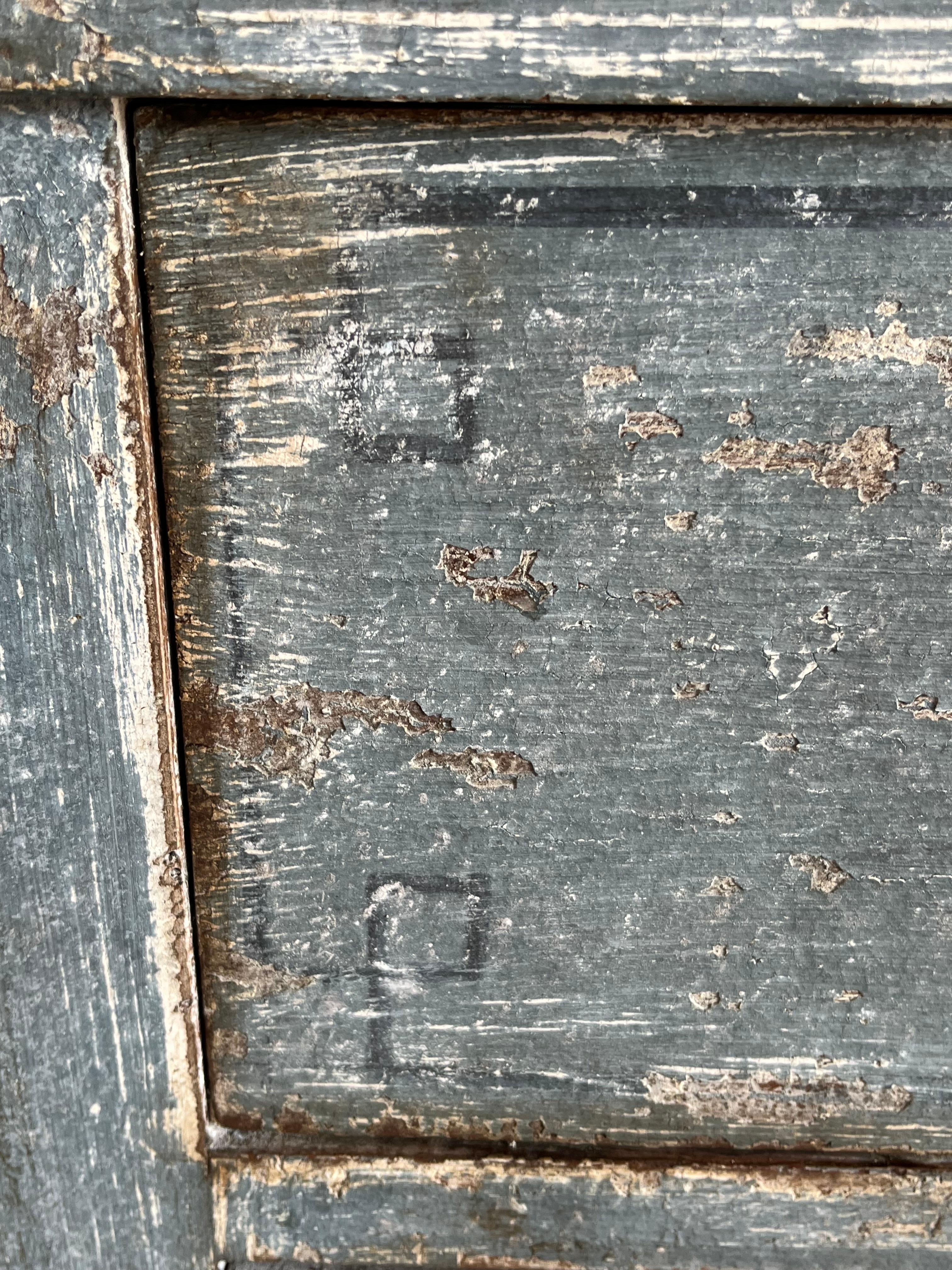 Neoclassical chest of drawers hand-crafted in Italy in the early 1800s using walnut and painted in a beautiful blue-jeans color. The chest features three inset drawers all with beautiful hand-made dovetail joints. The drawer fronts are flat and