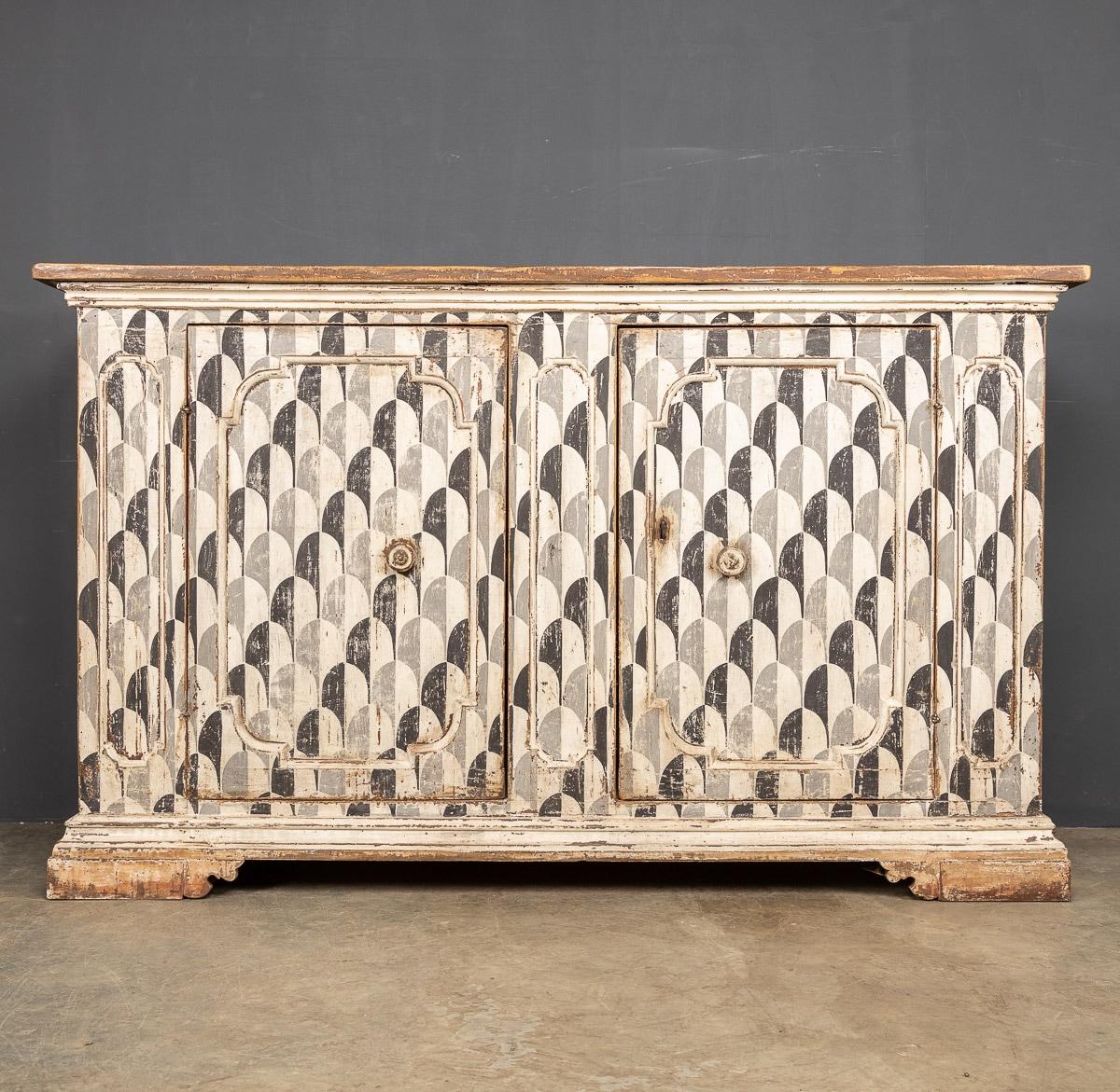 Antique mid-19th Century Italian pine credenza from a Tuscan farmhouse. This piece has been later painted in a striking geometric design, circa 1850. All original iron locks and key. A wonderful and rustic piece of statement furniture, ideal for