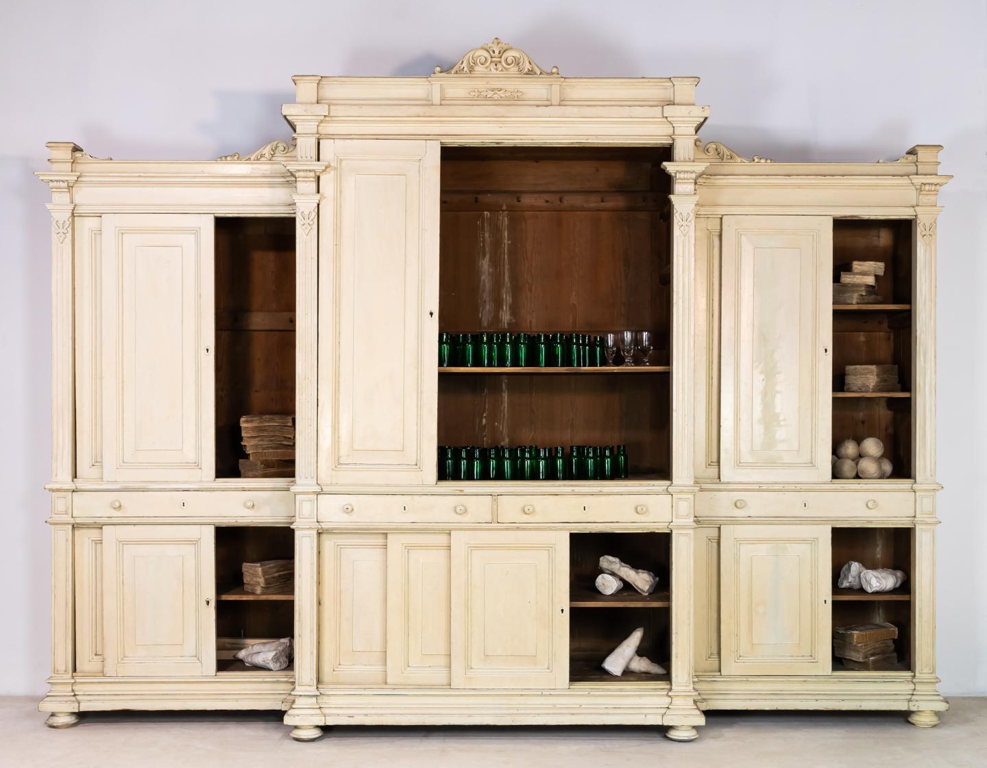 Monumental 19th century painted pine housekeepers cupboard with sliding doors to top and bottom.

  