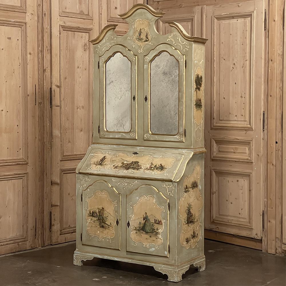 19th Century Italian painted secretary ~ bookcase is a fanciful and marvelous expression of the unique stylistic flair that originated in Venice centuries ago. The Baroque-inspired architecture includes a boldly arched triple crown, curvaceous