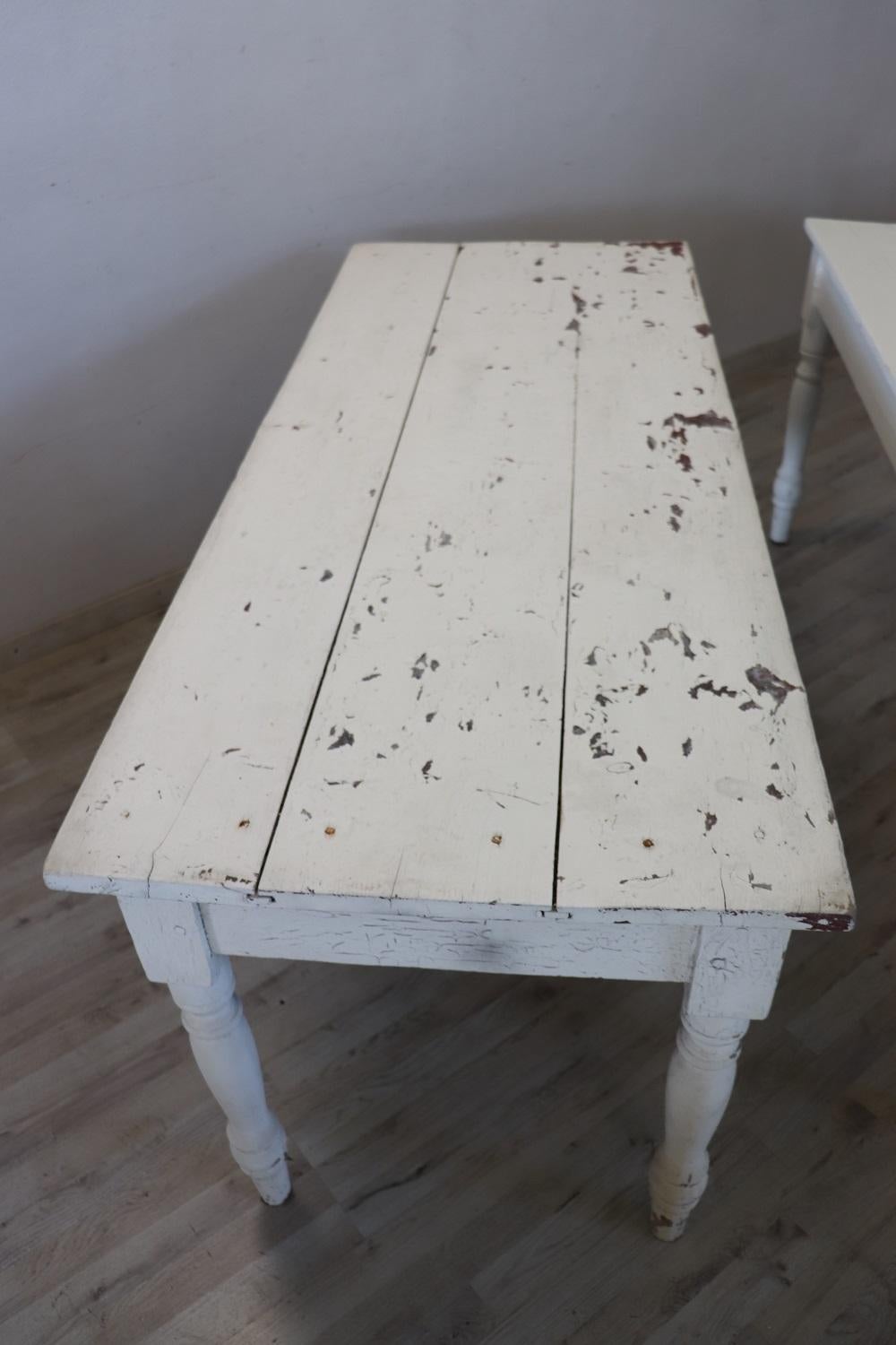 Beautiful antique rustic long dining room table, 1880, set of two. Made in solid poplar wood completely lacquered in white colour. Characterized by a solid turned legs. Very simple and linear, perfect also for a modern environment. This tables is