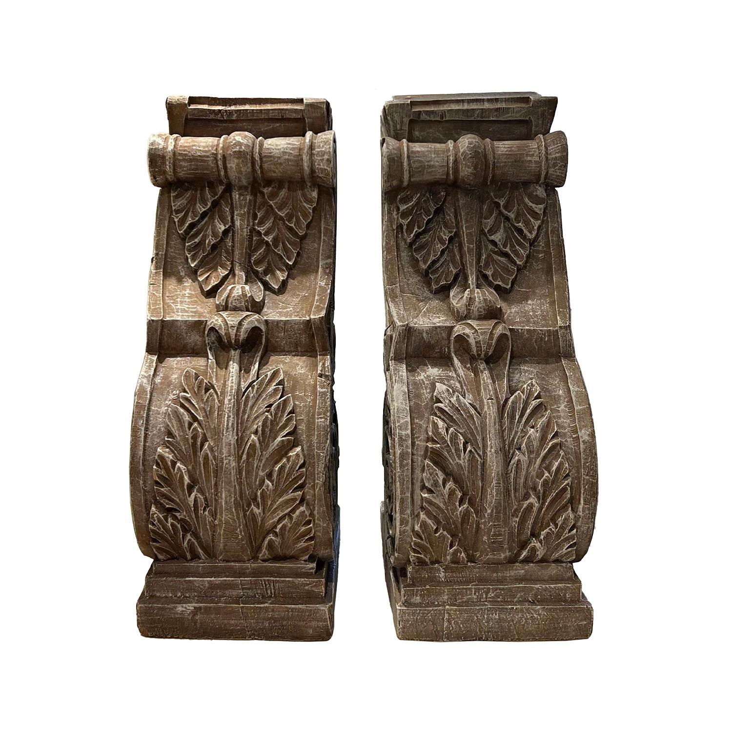 An antique pair of Italian wooden sconces decorated on three sides with florals and scrolls, in good condition. Minor fading, scratches due to age. Wear consistent with age and use. Circa 19th Century, Italy.